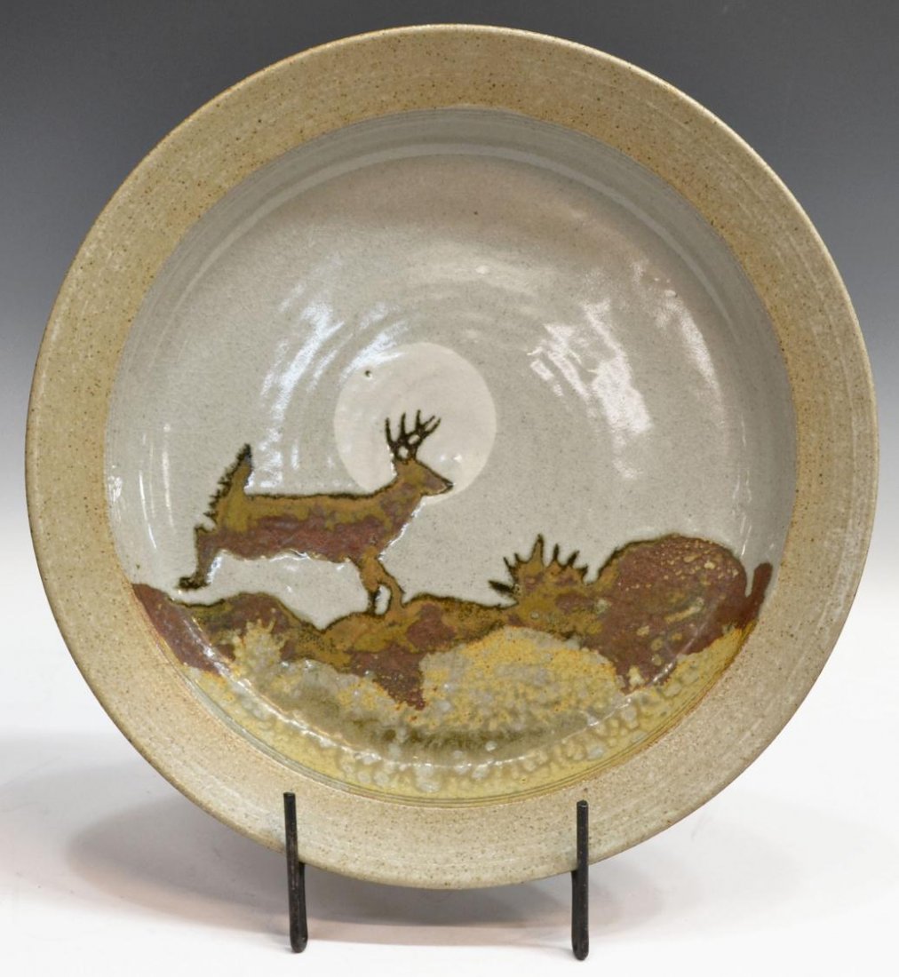 SOUTHWEST CHARGES, EDITH & DARRELL ROYAL: Large Southwest ceramic charger glazed, a deer running in the moonlight,, hand written sentiment by Edith Royal verso, a gift from Mr. & Mrs. Jim Bob Moffett, UT football 1959, 1960, chairman Freeport