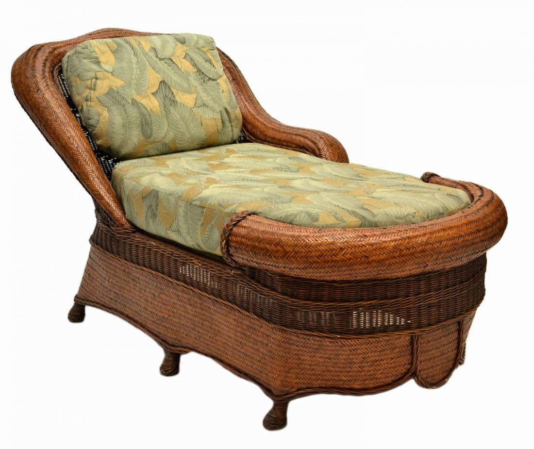 CUSTOM DESIGN RATTAN CHAISE LOUNGE CHAIR: Custom design rattan chaise lounge, the reclined chair fitted with loose cushion seat and backrest, some rattan loss, approx 37"h, 73.5"l, 36"w **Provenance: From the private collection of Mr. Beau Th