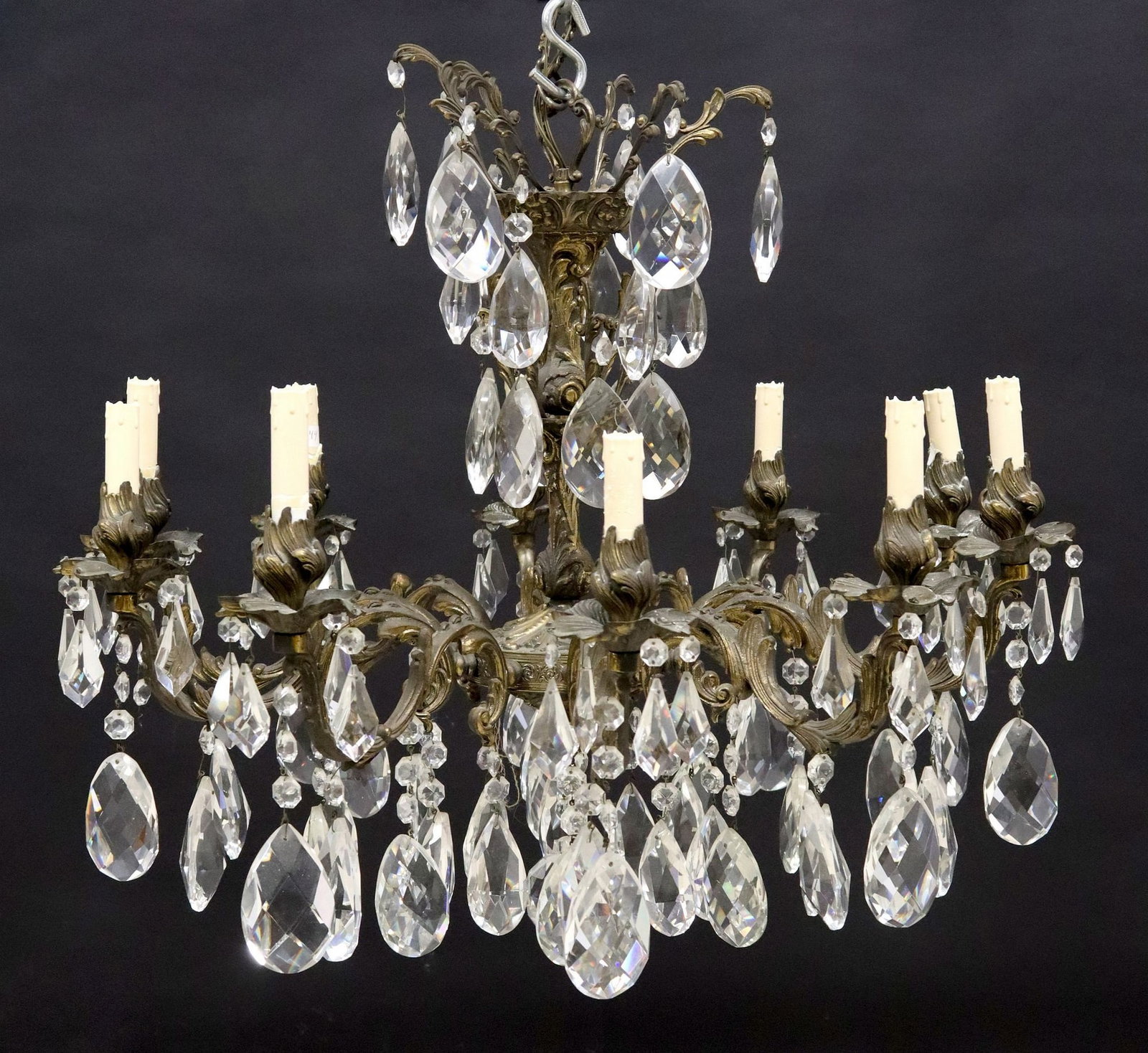 ITALIAN GILT METAL & CRYSTAL FOLIATED 10-LT CHANDELIER: Italian gilt metal and crystal ten-light chandelier, 20th c., having central standard, issuing ten foliated scroll arms hung with cut crystal drops, terminating on foliated bobeche with faux candlesti