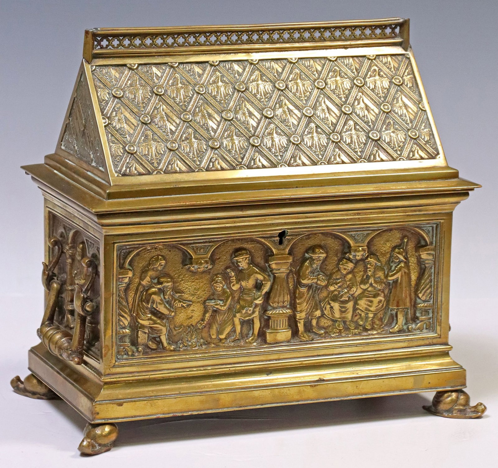 ENGLISH VICTORIAN GOTHIC REVIVAL BRASS CASKET: English Victorian Gothic Revival brass casket, attributed to Adolph Frankau & Company, late 19th c., having steepled and hinged lid decorated with pattern of eagles, opening to lined interior