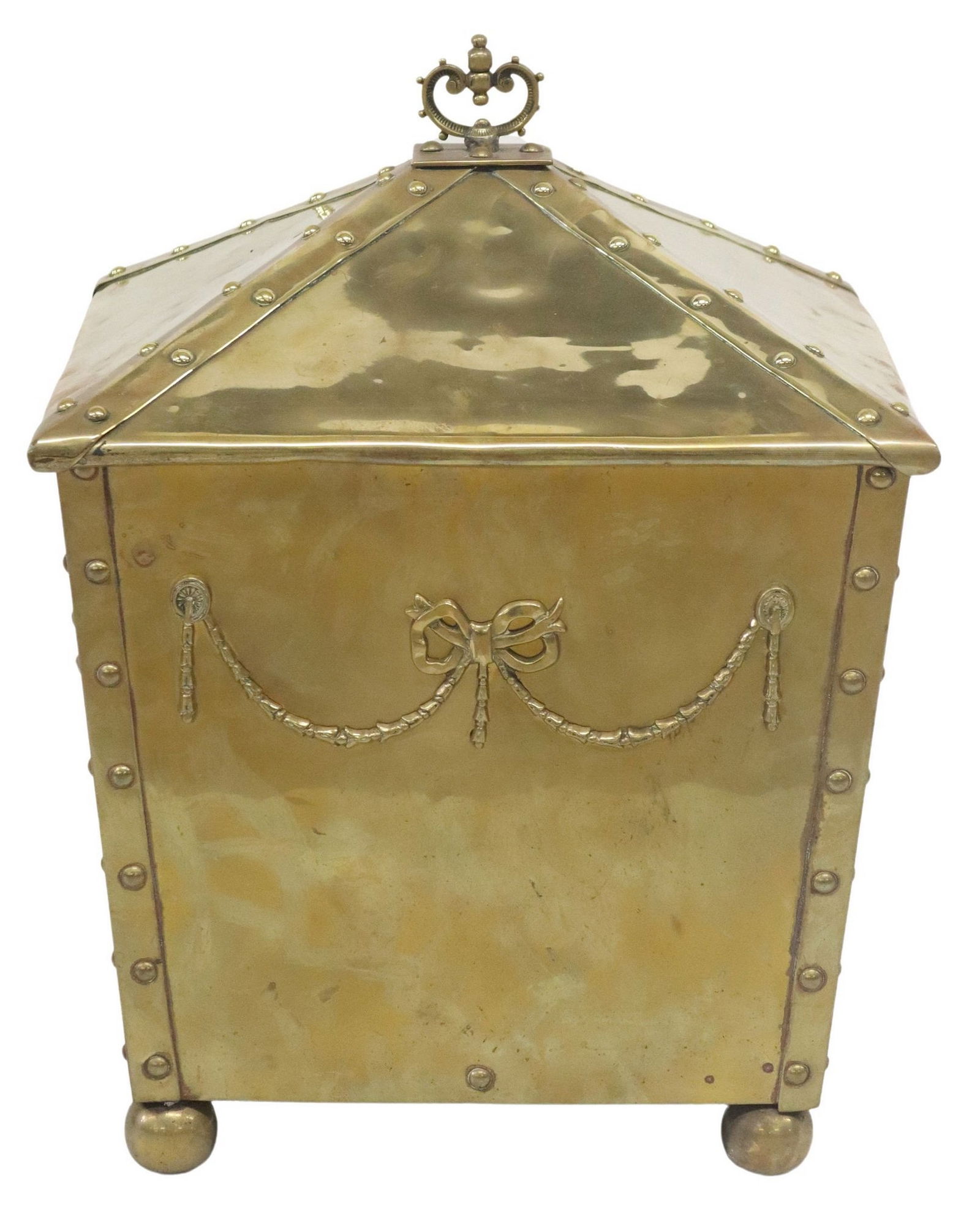 ENGLISH RIVETED & IRON-LINED BRASS COAL BIN: English brass coal bin, early 20th c., having a tapering square form with rivet details along vertical edges, pyramidical cover with scrolled finial, over iron-lined interior, dual handles and r