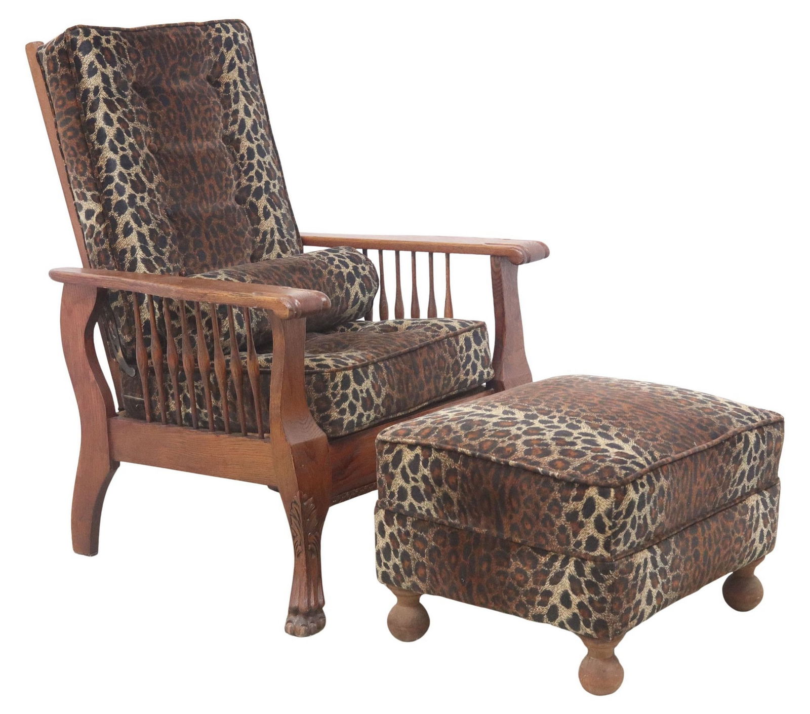 (2) AMERICAN OAK MORRIS STYLE RECLINING ARMCHAIR & OTTOMAN: (lot of 2) American carved oak seating group, each in later leopard print upholstery, including: (1) Morris style reclining armchair, early 20th c., having ladder back adjustable to five positions, ab