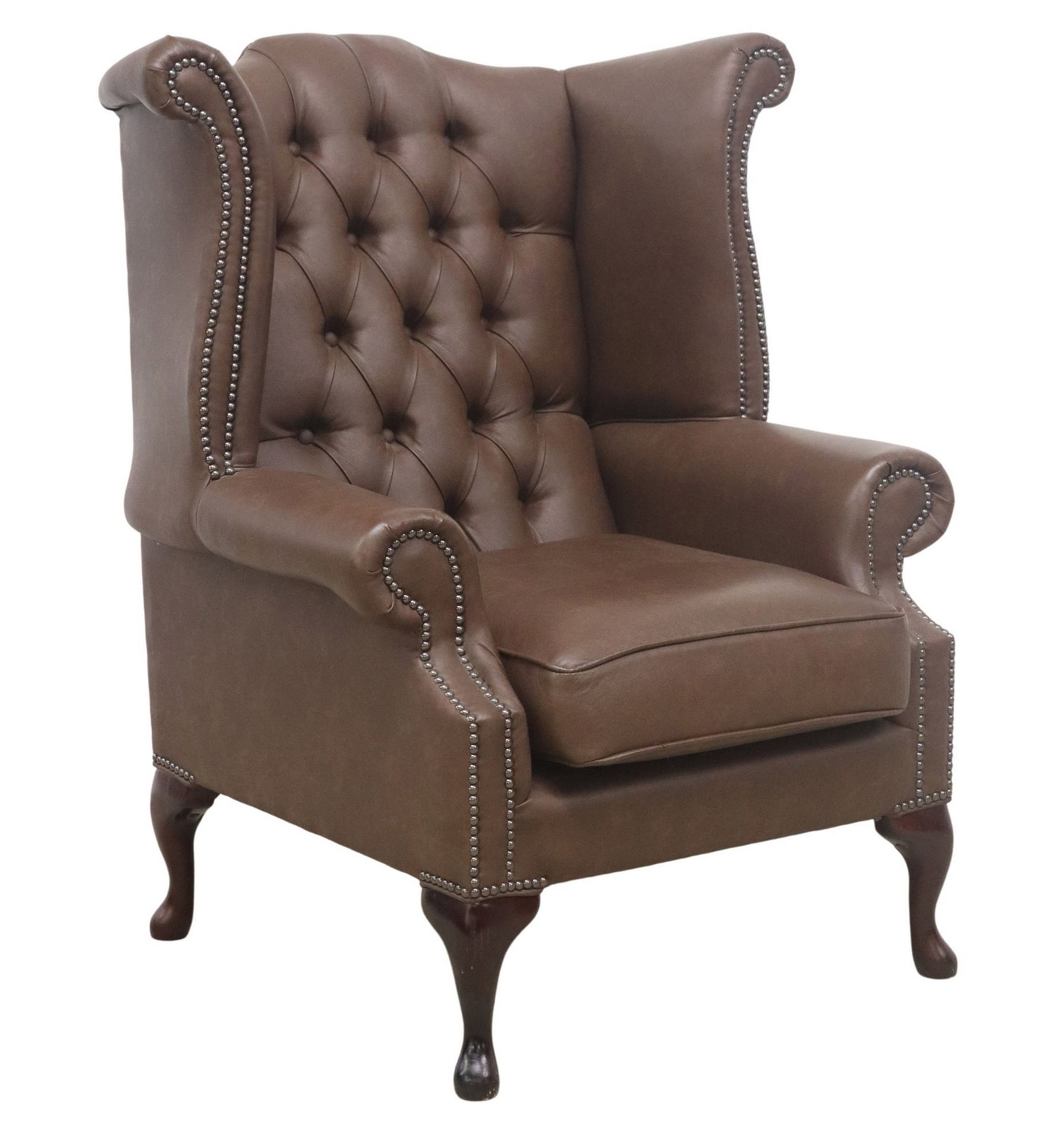 ENGLISH QUEEN ANNE STYLE BROWN LEATHER WINGBACK ARMCHAIR: English Queen Anne style wingback armchair, 21st c., in button-tufted brown leather upholstery, with nailhead trim, removable seat cushion, rising on cabriole legs, ending on pad feet, approx 42"