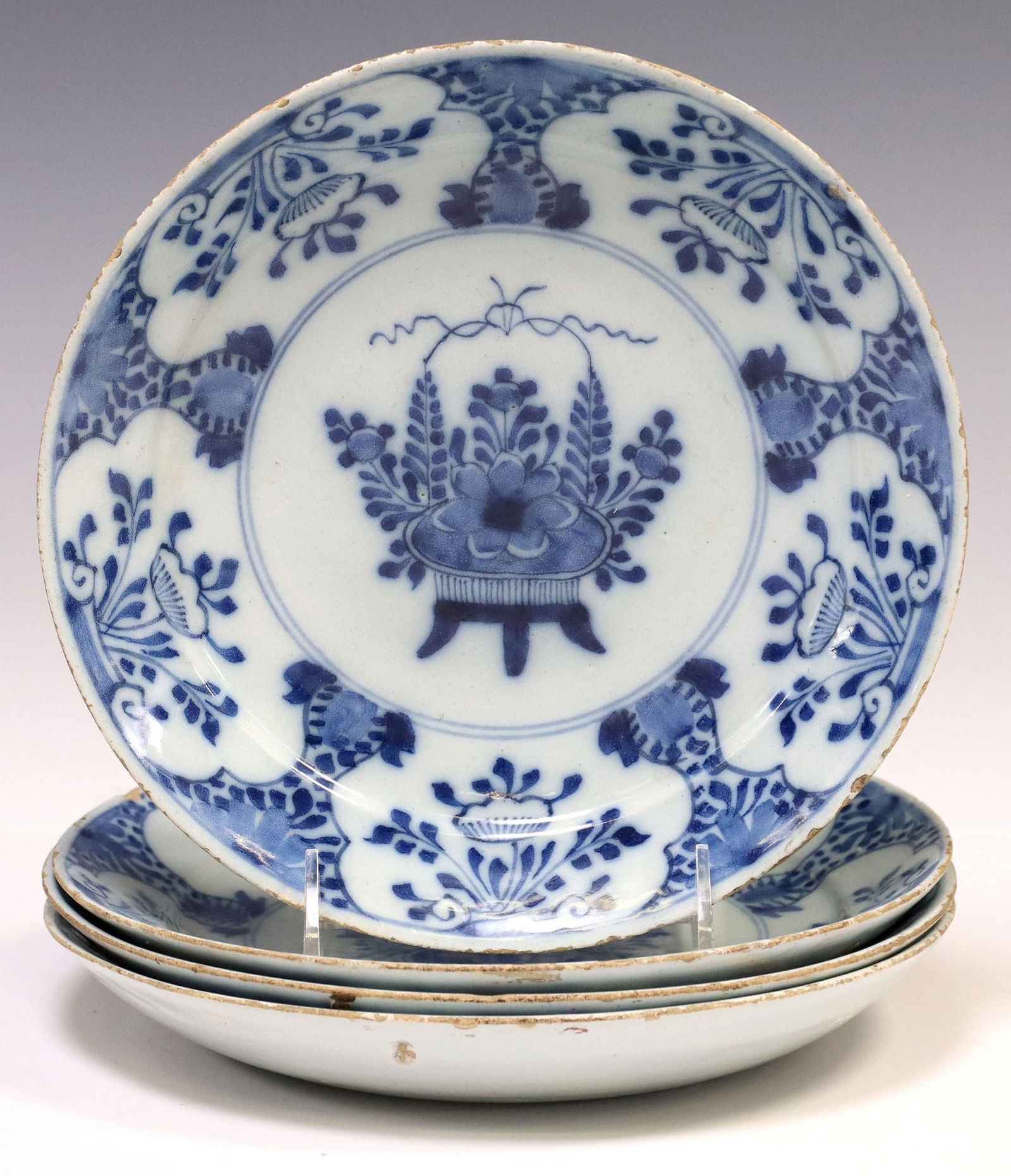 (4) DELFT BLUE & WHITE TIN-GLAZED FLORAL URN PLATES: (lot of 4) Delft blue and white tin-glazed earthenware plates, late 18th c., matched each centered by an urn with abundant flowers and sprigs, typical small rim chips and glaze los