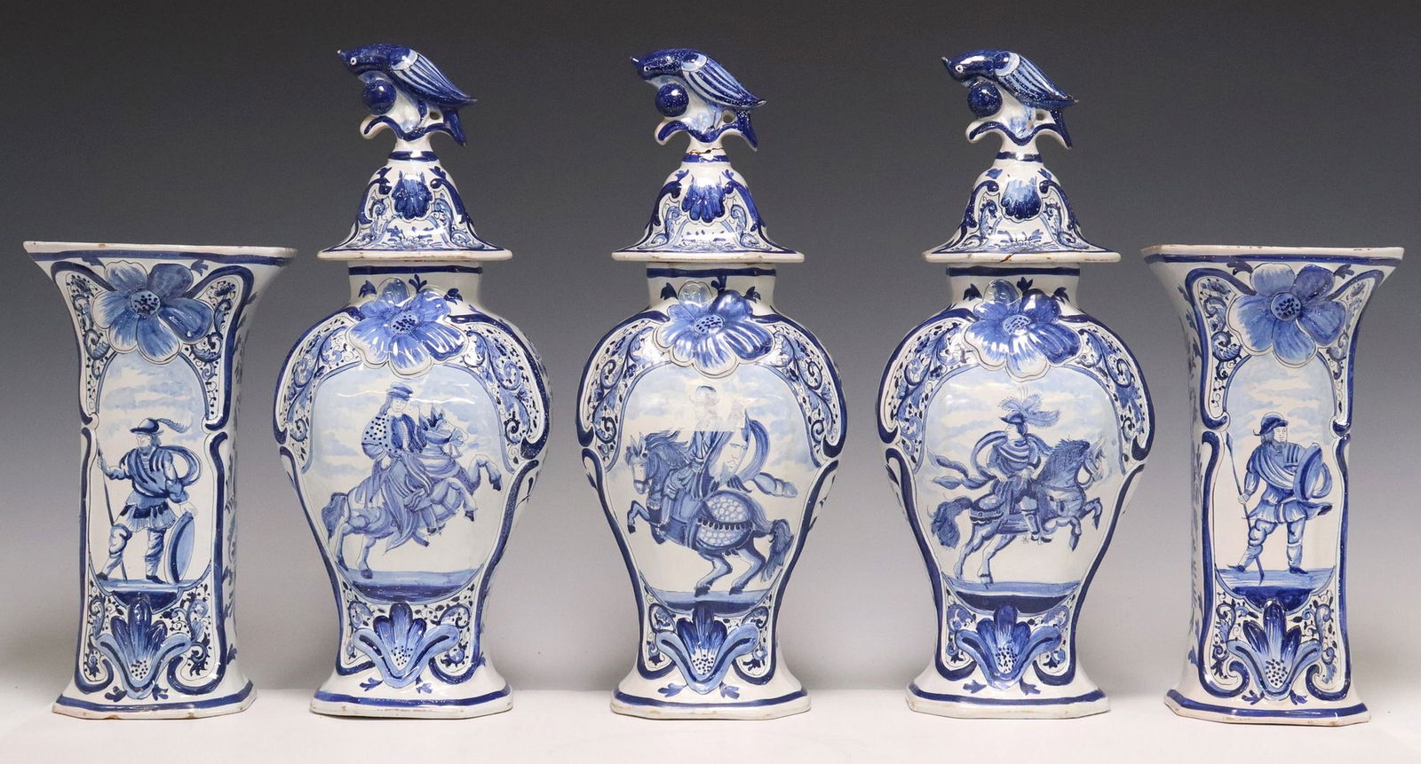 (5) DELFT BLUE & WHITE FAIENCE FIVE-PIECE GARNITURE SET: (lot of 5) Delft blue and white tin-glazed earthenware garniture set, 19th c., each painted with Chinoiserie flowers, RPK initial mark underfoot, including: (3) octagonal beaker vases, domed cove