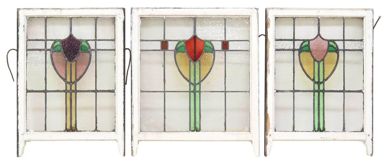 (3) ENGLISH STAINED & LEADED GLASS ARCHITECTURAL WINDOWS: (lot of 3) English architectural stained and leaded glass windows, early 20th c., worn white painted wood frames, encasing clear and polychrome textured glass panels, of varied foliate and geometric d