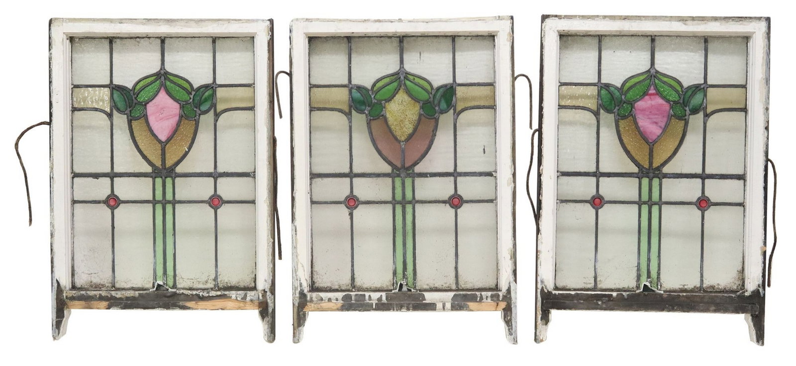 (3) ENGLISH STAINED & LEADED GLASS ARCHITECTURAL WINDOWS: (lot of 3) English architectural stained and leaded glass windows, early 20th c., worn white painted wood frames, encasing clear and polychrome textured glass panels, of foliate and geometric designs,