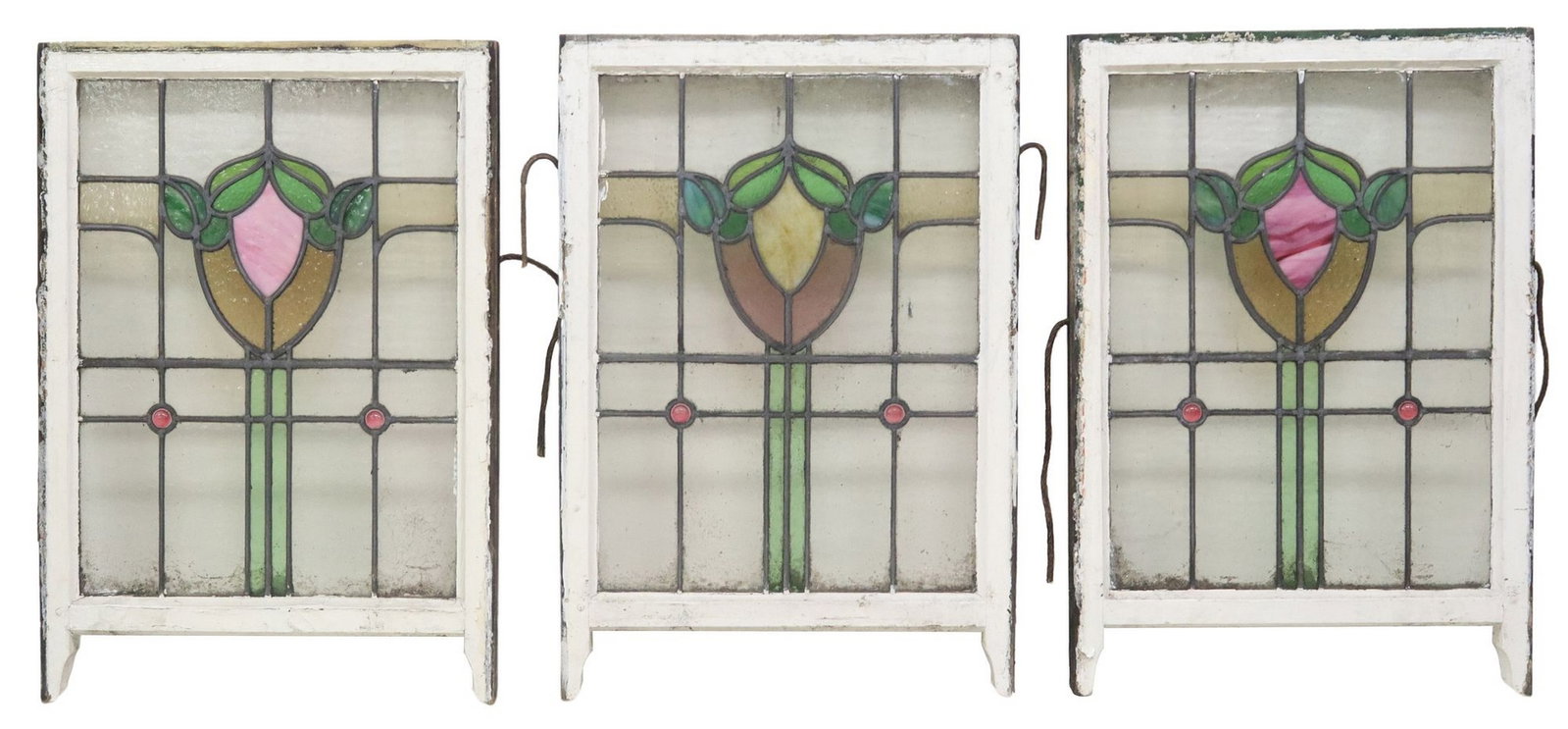 (3) ENGLISH STAINED & LEADED GLASS ARCHITECTURAL WINDOWS: (lot of 3) English architectural stained and leaded glass windows, early 20th c., worn white painted wood frames, encasing clear and polychrome textured glass panels, of foliate and geometric designs,