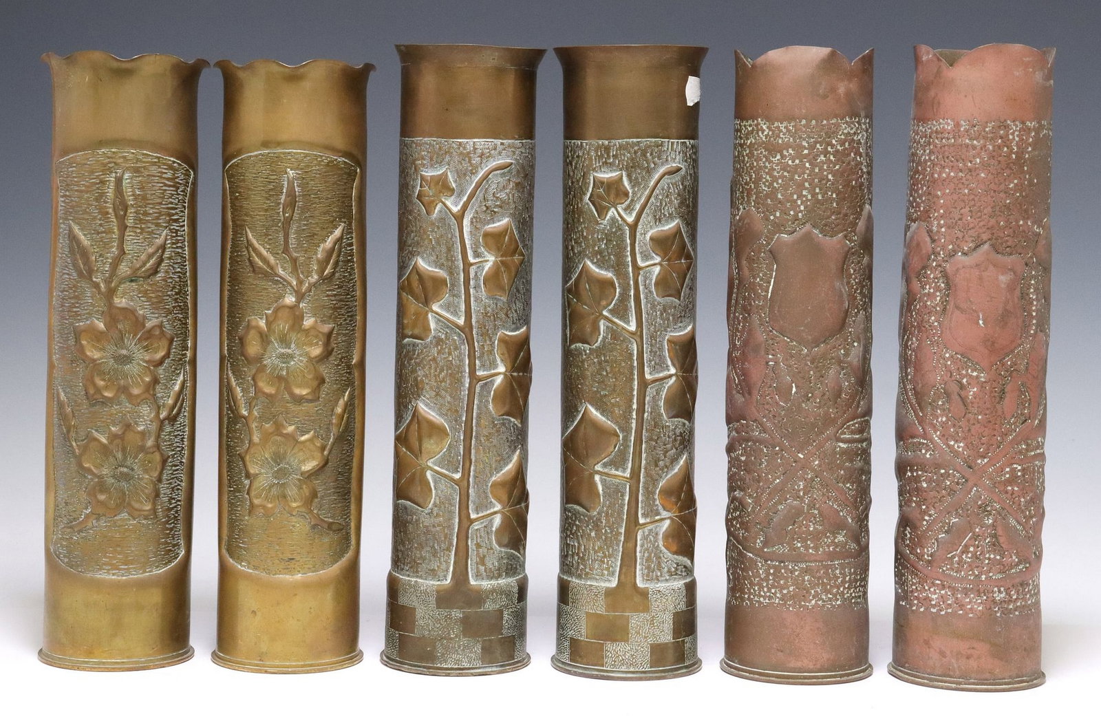 (6) FRENCH WWI-ERA TRENCH ART ARTILLERY SHELL VASES: (lot of 6) French WWI-era trench art vases, fashioned from artillery shells, including: (2) having flared and scalloped rim, over repousse flowers, reverse side inscribed "Mesnip? les Hurlus