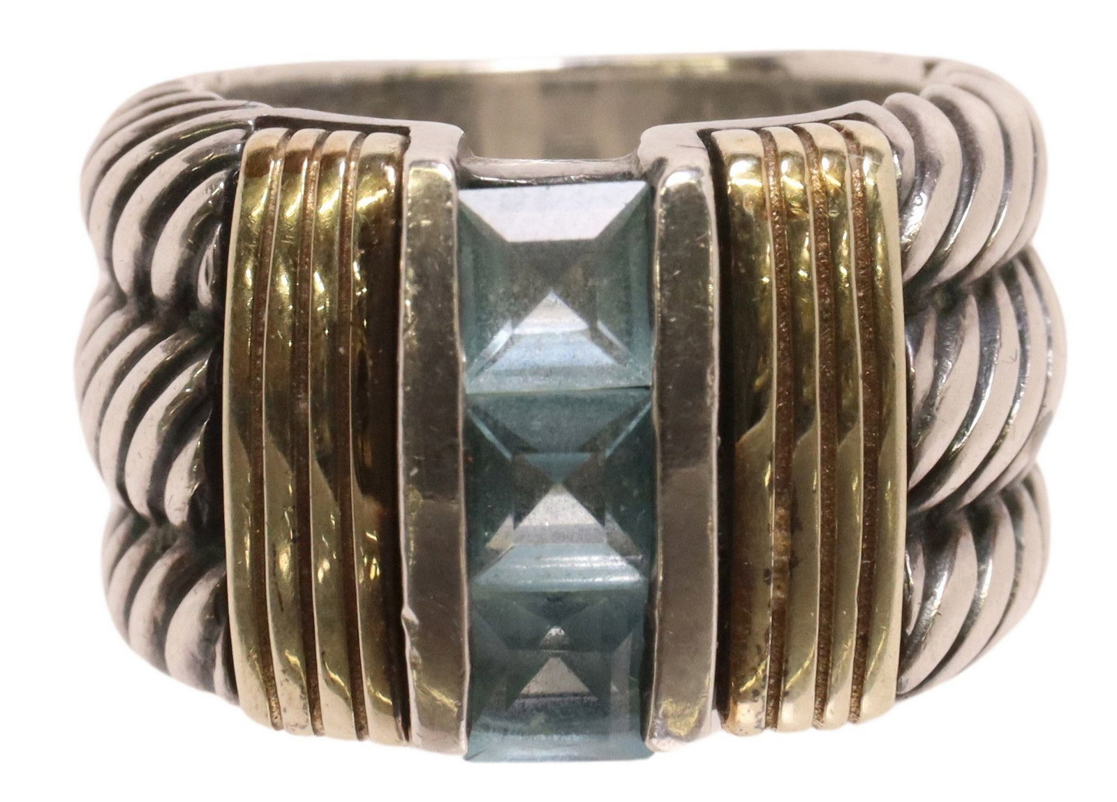 ESTATE SILVER & YELLOW GOLD BLUE TOPAZ CABLE RING: Estate silver (content unknown) and yellow gold ring, three square-cut pale blue gemstones, likely blue topaz, triple cable twist shoulders, apparently unmarked, approx size 5.5-6, 17.3 grams (in