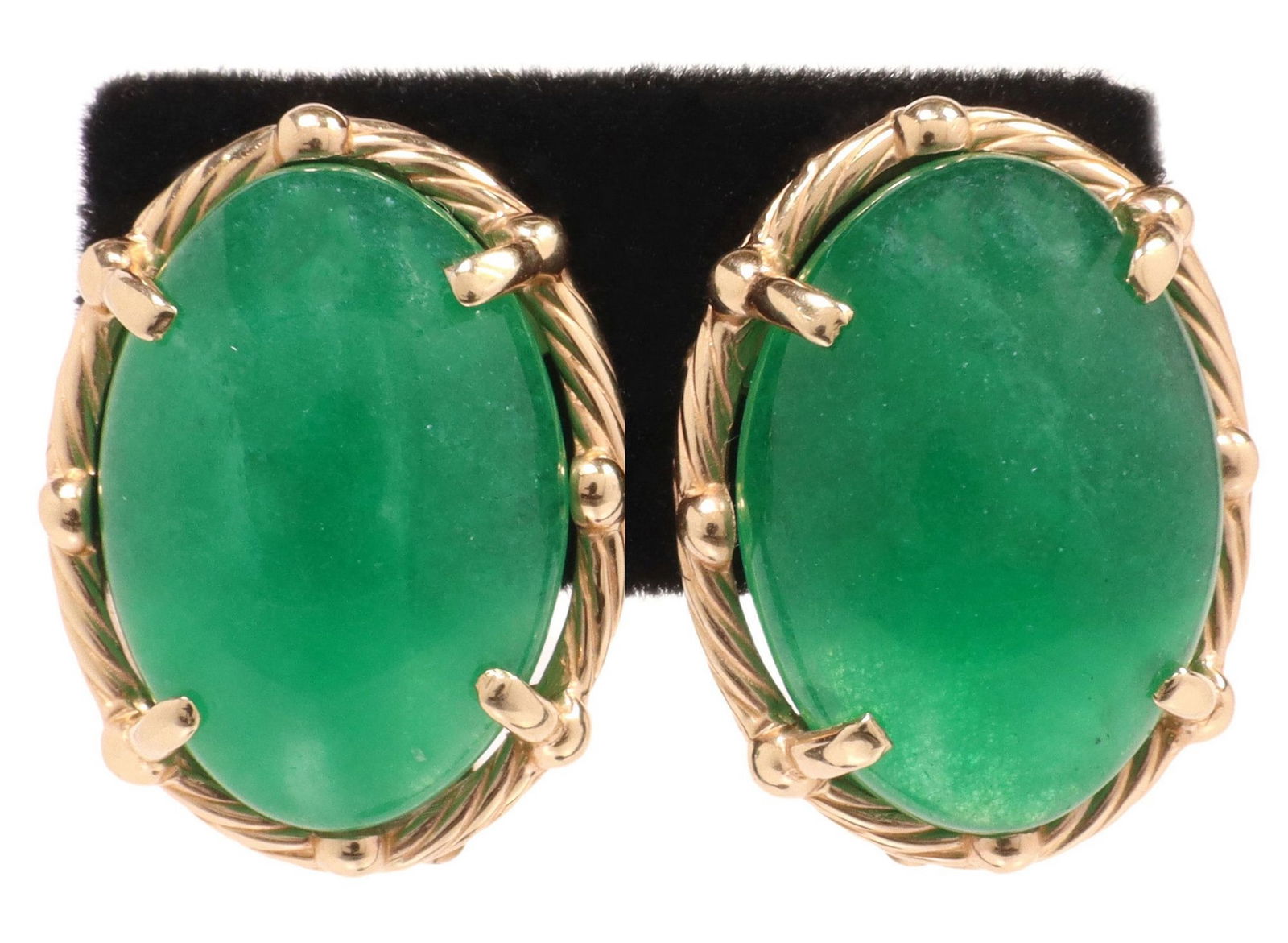 (PAIR) ESTATE 14KT GOLD CABOCHON GREEN JADEITE EARRINGS: (pair) Estate 14kt yellow gold earrings, cabochon-cut green jadeite, approx 14.85cttw, twisted rope bezel, post and French clip backs, clips hallmarked 585, approx 7/8"l, 5/8"w, 9.2 gra
