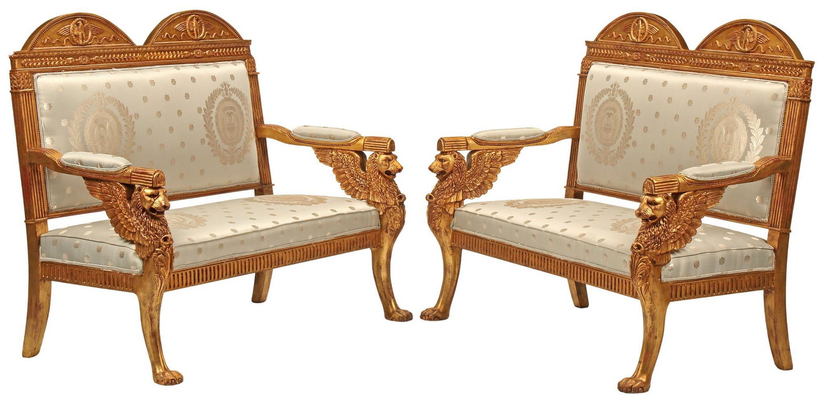 (2) EMPIRE STYLE GILTWOOD CARVED WINGED LION SALON SETTEES: (pair) Empire style giltwood settees, having dual arched pediments with eagle on garland wreath, padded arms and seat in a powder blue silk upholstery, winged lion terminals ending on paw feet, approx
