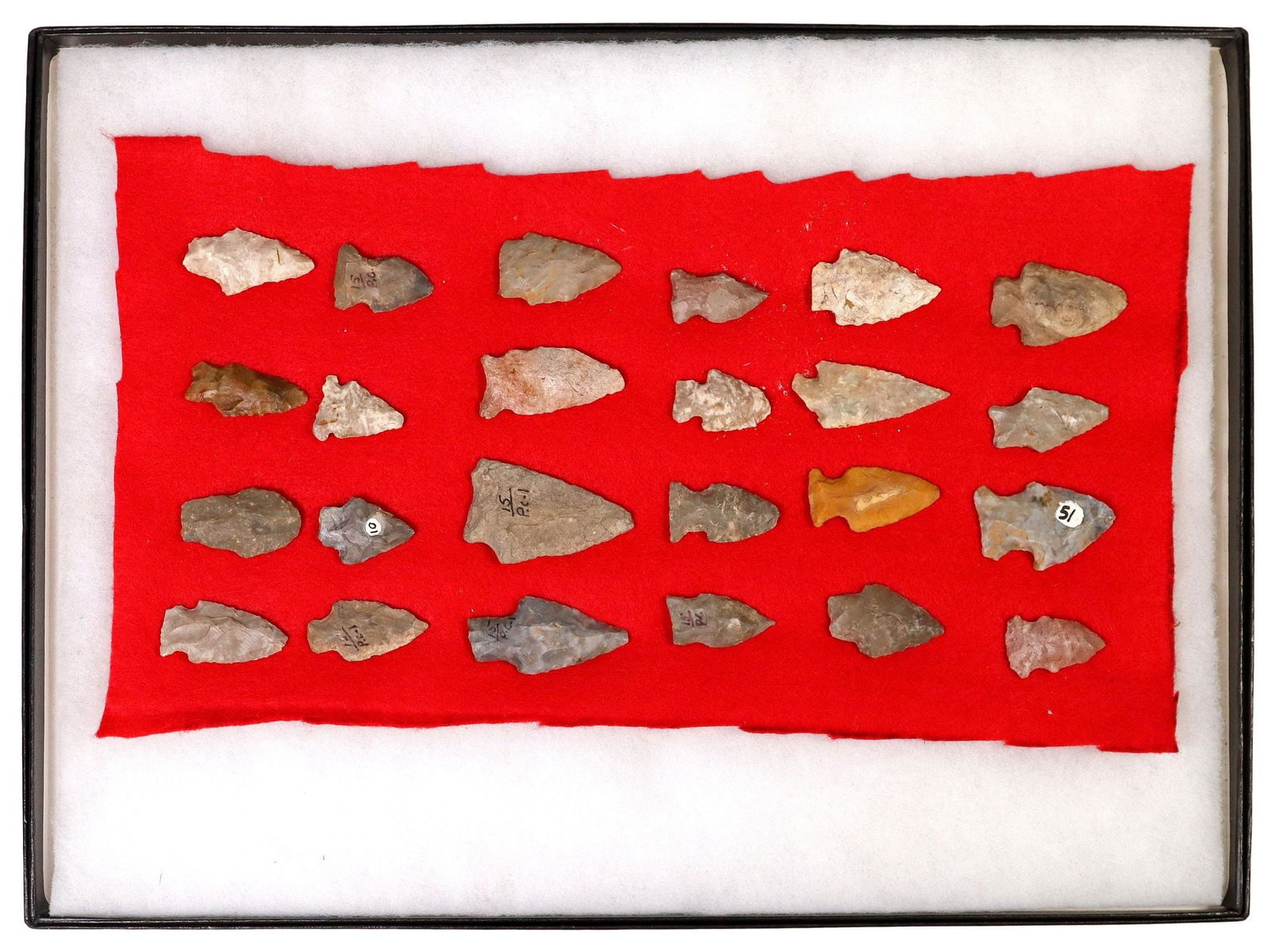 (24) VARIOUS STONE ARROWHEADS HOUSED IN RIKER BOX: (lot of 24) Stone arrowheads, all affixed to red fabric backing, housed in Riker box, largest: approx 2.25"l, 1.5"w, overall in case: approx 16.25"l, 12.25"w, 0.75"d, 2.5lbs t