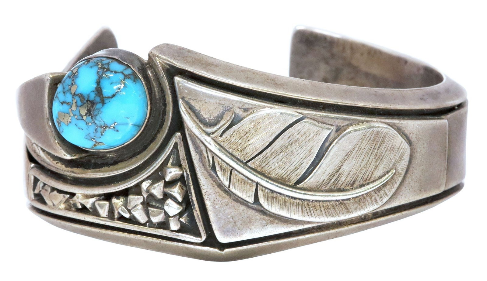 WILBERT (WIL) VANDEVER (D.2018) NAVAJO SILVER & TURQUOISE CUFF BRACELET: Estate Native American silver (content unknown) and turquoise cuff bracelet, signed WCV within feather (Wilbert "Wil" Vandever, Navajo/ Dine, 1951-2018), shaped cuff with fea