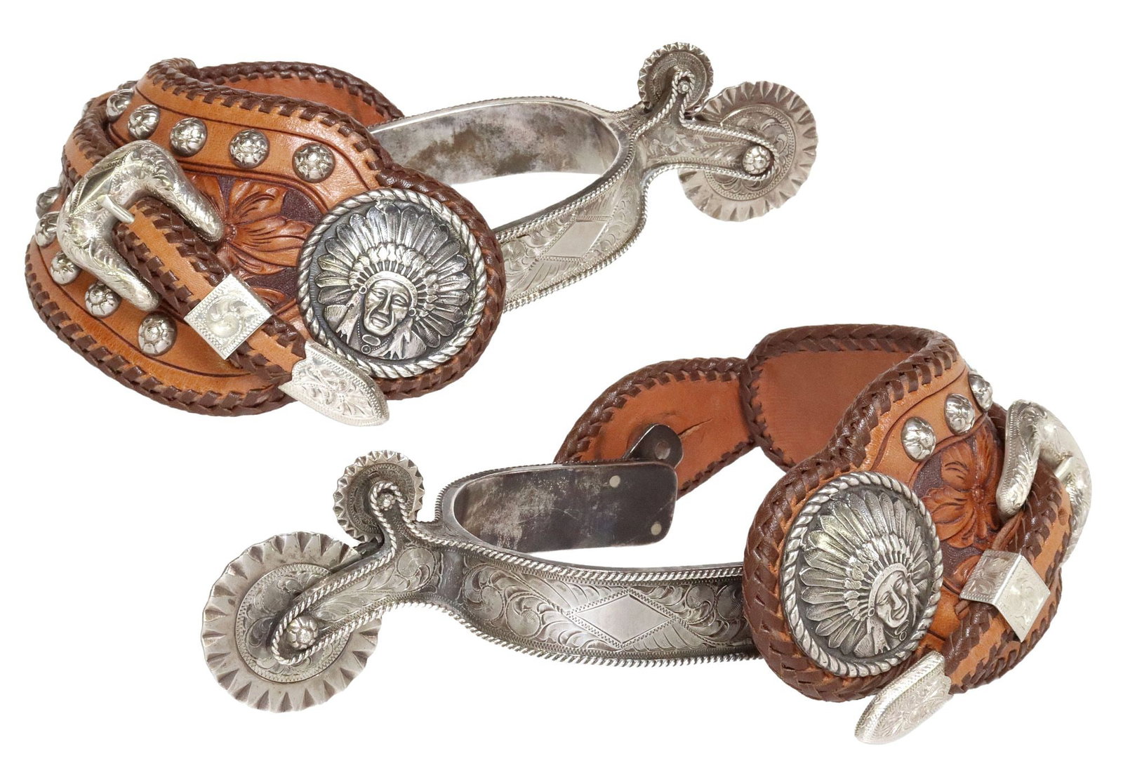 (PAIR) EDWARD H. BOHLIN ENGRAVED SILVER INDIAN HEAD PARADE SPURS: (pair) Western sterling silver parade spurs, Edward H. Bohlin, Hollywood, California, heel bands engraved in a foliate motif, kick rope edge, double cookie-cutter rowels (the larger approx 1