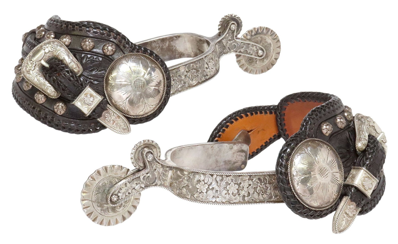 (PAIR) EDWARD H. BOHLIN ENGRAVED SILVER PARADE SPURS: (pair) Western sterling silver parade spurs, Edward H. Bohlin, Hollywood, California, heel bands engraved in a floral and foliate motif, kick rope edge, double cookie-cutter rowels (the
