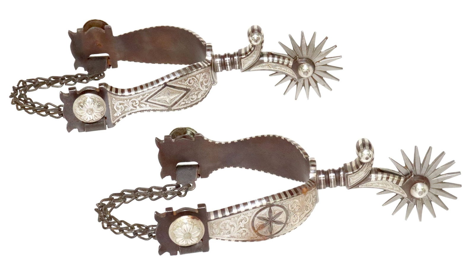 (PAIR) PERRY D. SHIRLEY (B.1949) FLAGSTAFF AZ SILVER-INLAID 'DANDY' SPURS: (pair) Western silver-inlaid steel spurs, marked P. Shirley, Flagstaff, AZ (Perry D. Shirley, Texas, Arizona, b.1949), heel bands engraved in a floral and foliate motif, 2" eighteen-point ro