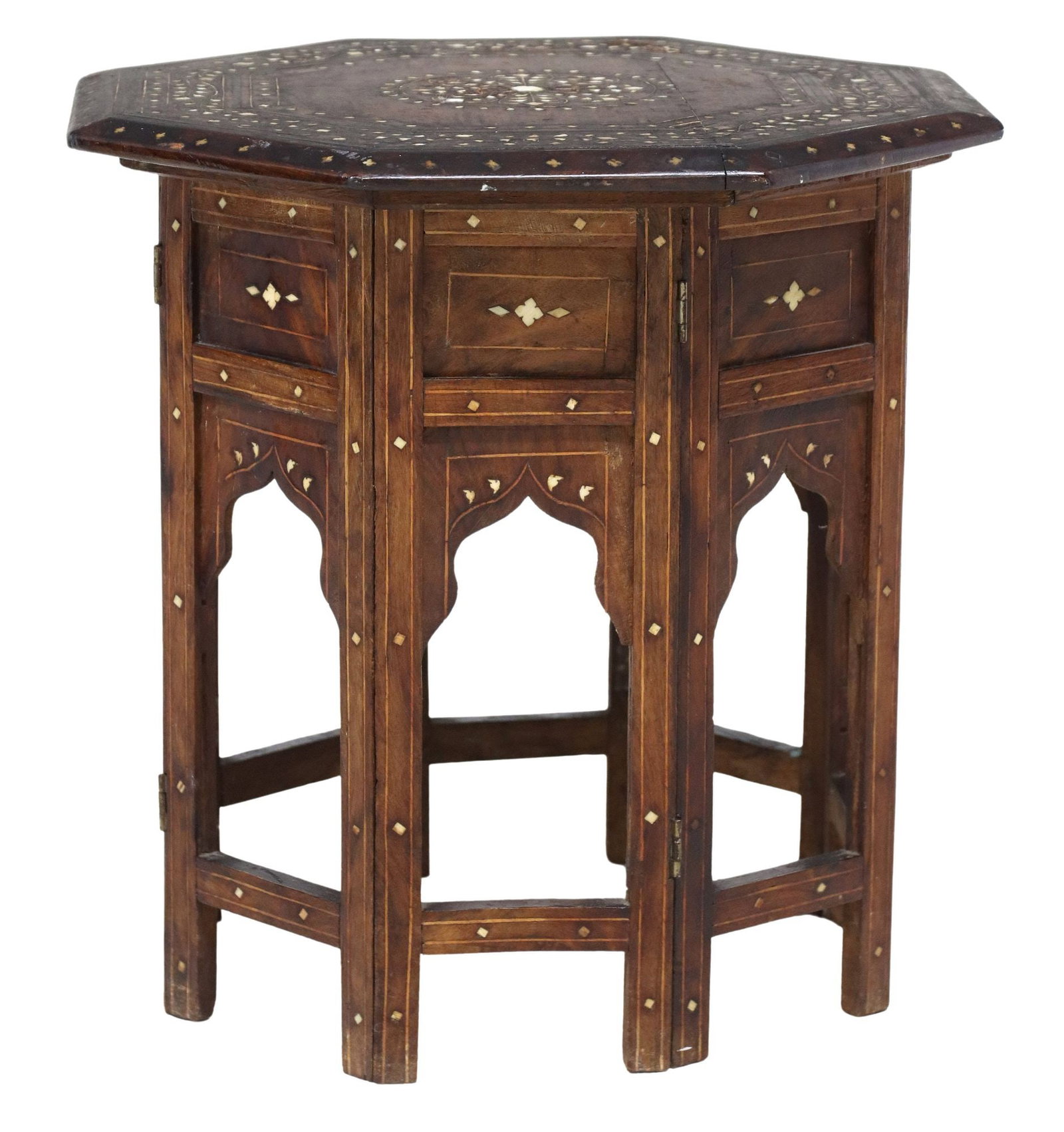 SMALL MOROCCAN BONE-INLAID FOLDING OCTAGONAL SIDE TABLE: Small Moroccan bone-inlaid collapsible side table, octagonal top with central floral medallion and scrolled foliate trim, underside revealing butterfly joinery, rising on collapsible stand compri