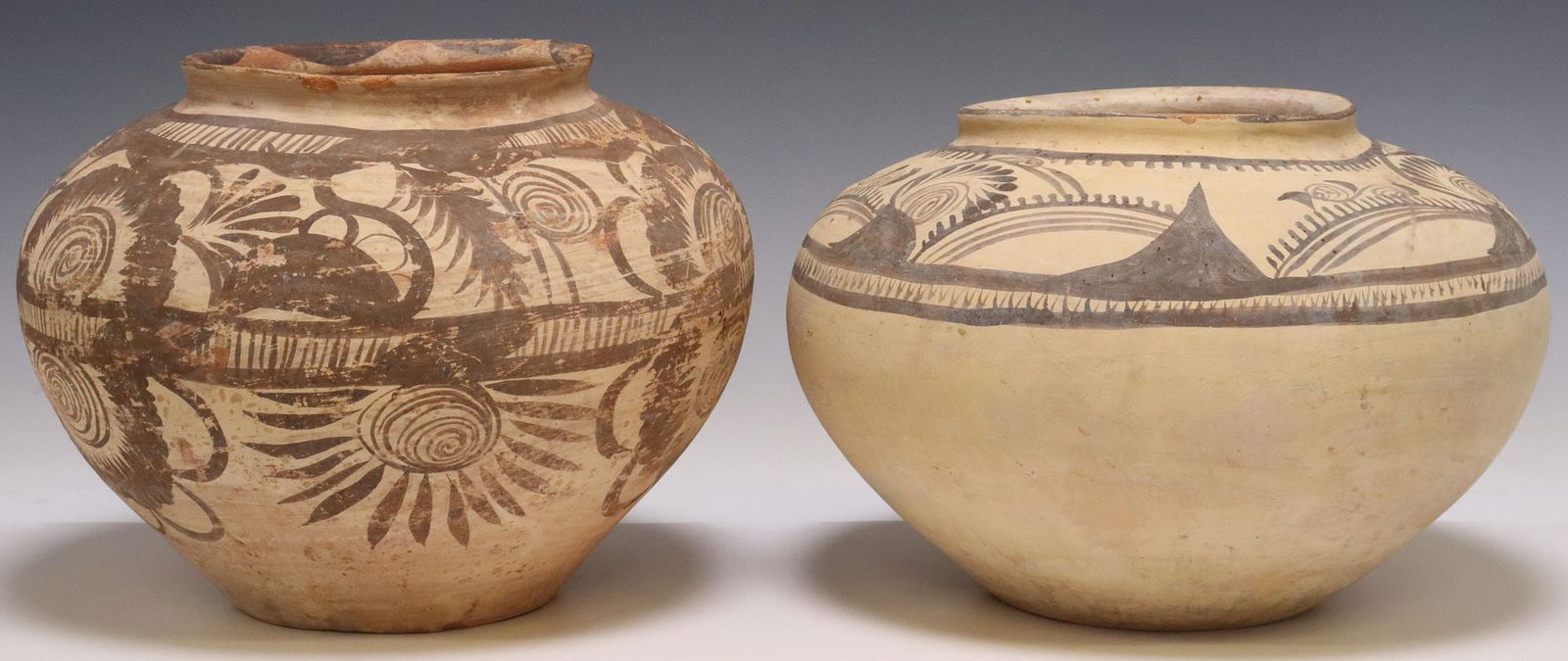 (2) LARGE POTTERY OLLAS VESSELS, HIDALGO, MEXICO: (lot of 2) Large pottery ollas/ water jars, Hidalgo, Mexico, tapering globular body, both with painted foliates between registers of geometric trim in a dark brown slip, including: (1) redware, c