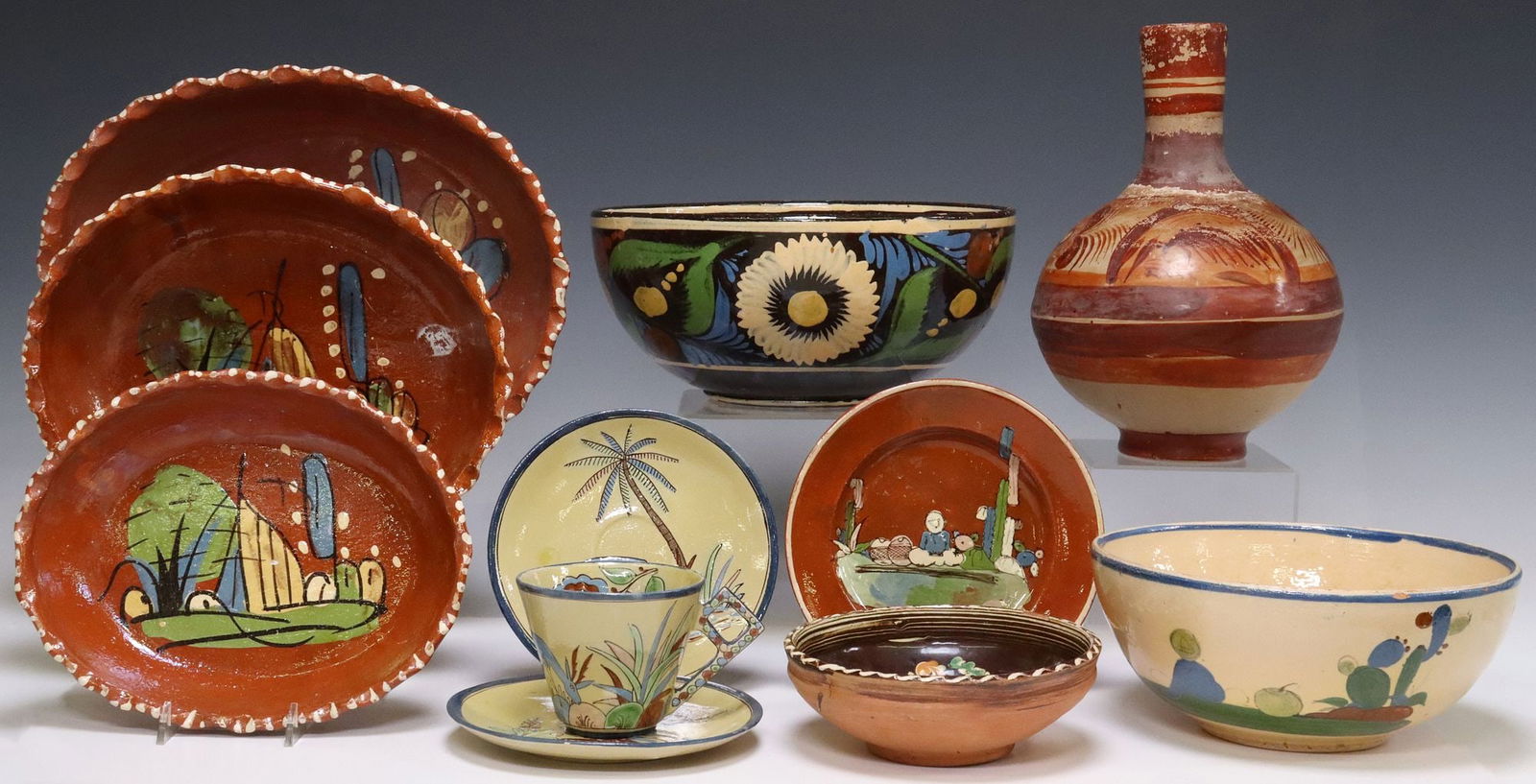 (11) COLLECTION OF FOLK ART POTTERY TABLEWARE, MEXICO: (lot of 11) Collection of folk art pottery tableware, Mexico, 20th c., including: (3) redware shallow serving bowls, each with scalloped border and painted landscapes, stamped Mexico underfoot, (1) re