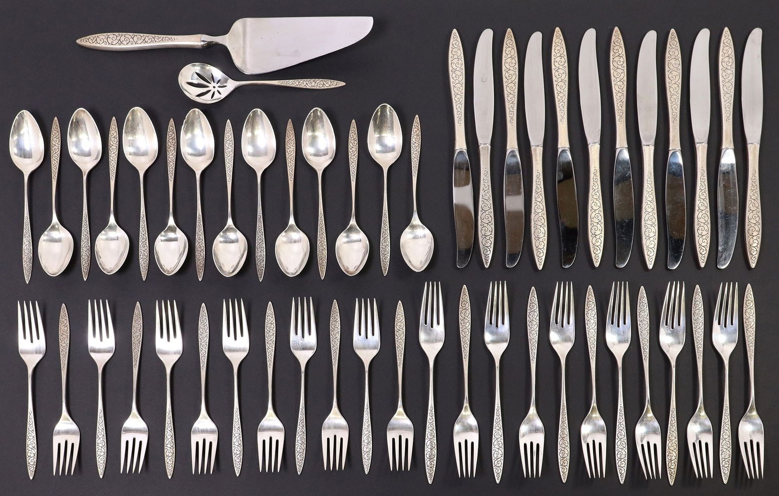 (52) WALLACE 'SPANISH LACE' STERLING SILVER FLATWARE SERVICE: (lot of 52) American sterling silver flatware service, Wallace Silversmiths, in the "Spanish Lace" pattern, including: (12) hollow handle knives, with stainless steel blade, approx 9.25