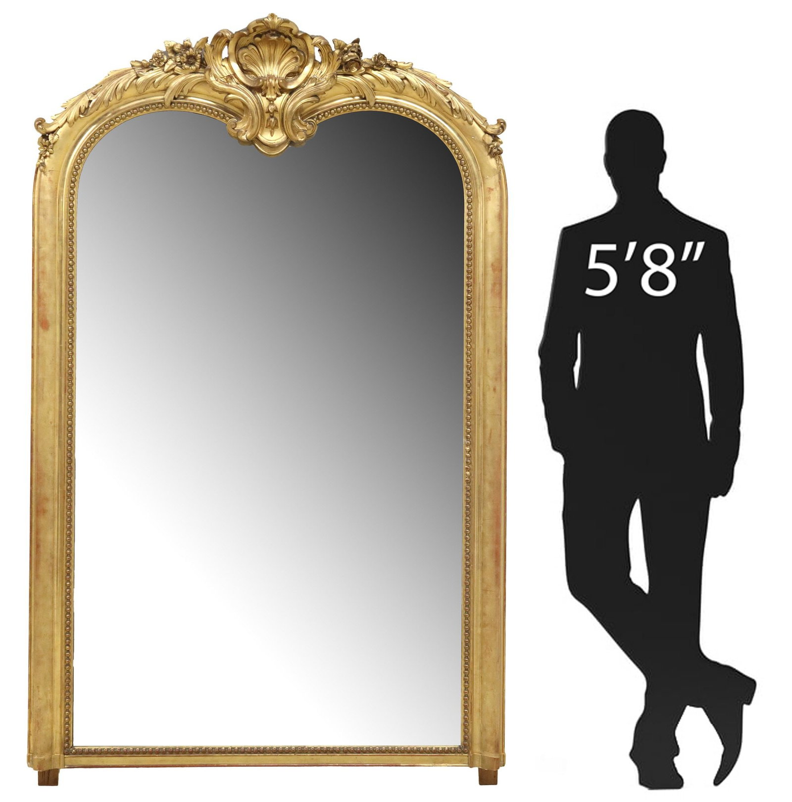 LARGE FRENCH LOUIS XV STYLE GILTWOOD MIRROR, 79" X 50": Large French Louis XV style giltwood mirror, late 19th c., having fanned gesso crest with scrolled foliate motifs, over arched frame with beaded trim, encasing flat mirror plate, small losses and rest