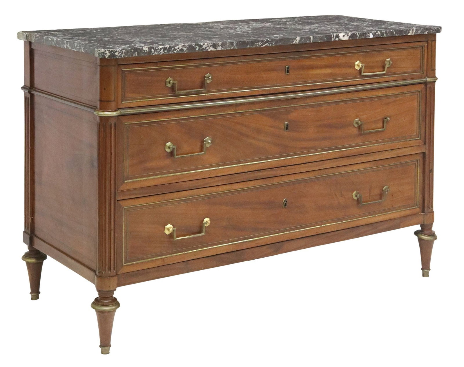 FRENCH LOUIS XVI STYLE MARBLE-TOP MAHOGANY COMMODE: French Louis XVI style mahogany commode, early 20th c., having shaped marble top, above three drawers, flanked by fluted corner posts, rising on tapered legs, ending on brass cap feet, approx 34"