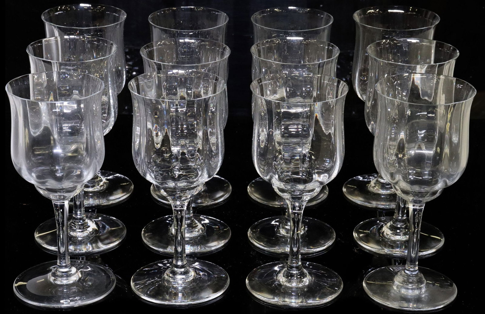 (12) FRENCH BACCARAT CAPRI OPTIC CRYSTAL CLARET WINE GLASSES: (lot of 12) French Baccarat crystal claret wine glasses, in the "Capri" pattern, with optic fluted bowl, plain stem and foot, (one) with small chip to rim, approx 6"h, 2.75"diam;&n