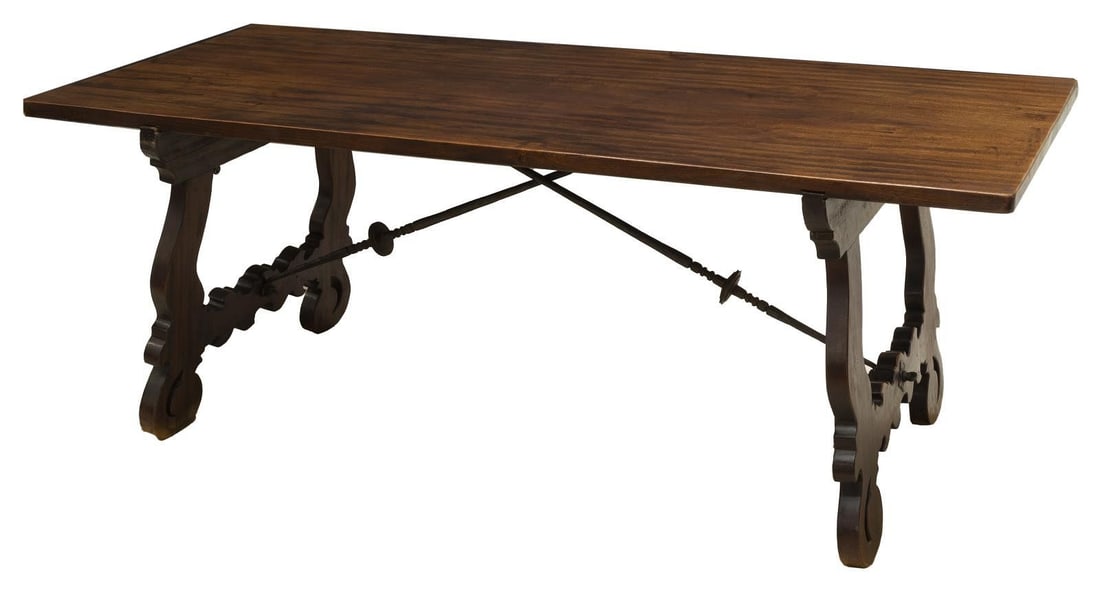 SPANISH BAROQUE STYLE WALNUT DINING TABLE, 79"L: Spanish Baroque style walnut dining table, early 20th c., having rectangular top, rising on ox yoke trestle legs, joined by scrolled iron supports, approx 30"h, 79"l, 33.5"w