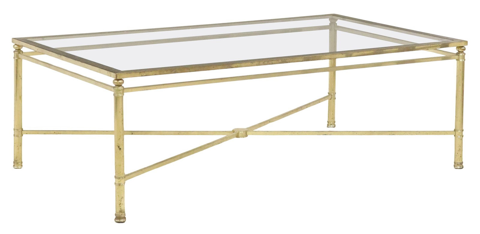 FRENCH GLASS-TOP GILT METAL RECTANGULAR COFFEE TABLE: French gilt metal and glass coffee table, 20th c., having rectangular colorless glass top, rising on fluted supports, joined by cross stretcher, approx 16.5"h, 46.75"w, 27"d