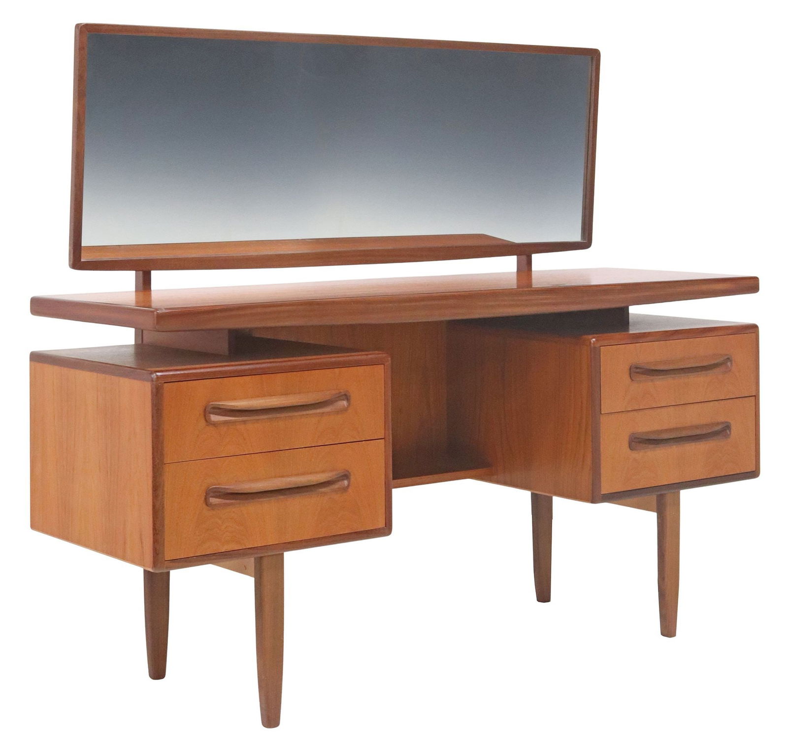 G PLAN 'FRESCO' MID-CENTURY MODERN TEAK MIRRORED VANITY: Mid-century modern "Fresco" teak vanity/ dressing table, Victor B. Wilkins for G Plan, c.1970s, tilting rectangular framed flat mirror plate, over the floating top, base with two drawers to either sid