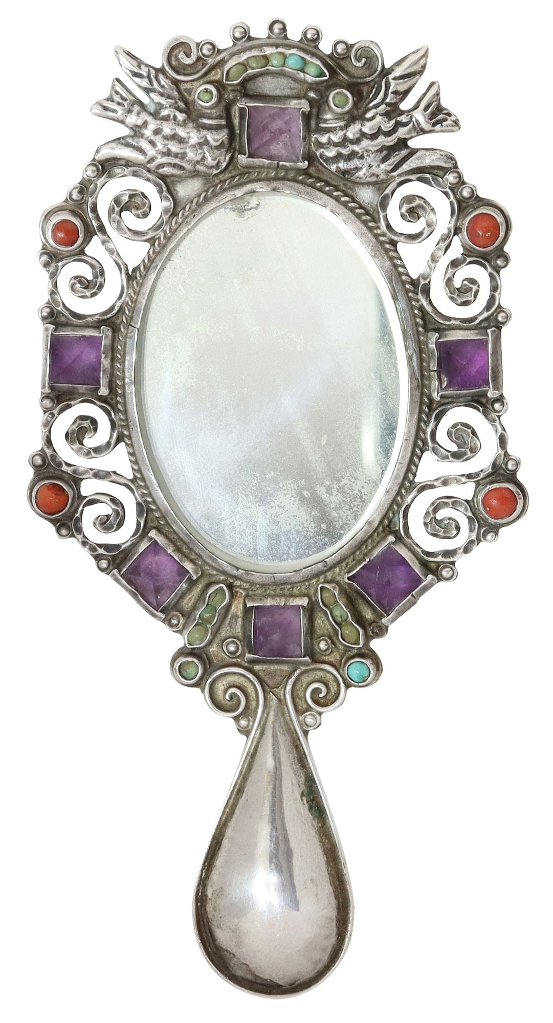 MATILDE POULAT (D.1960) GEM-SET STERLING MIRROR: Sterling silver hand mirror, Matilde Poulat (Mexican, d.1960), with inlays of amethyst, red coral and turquoise, repousse birds and scrolled openwork design, center oval mirror with thin beveled
