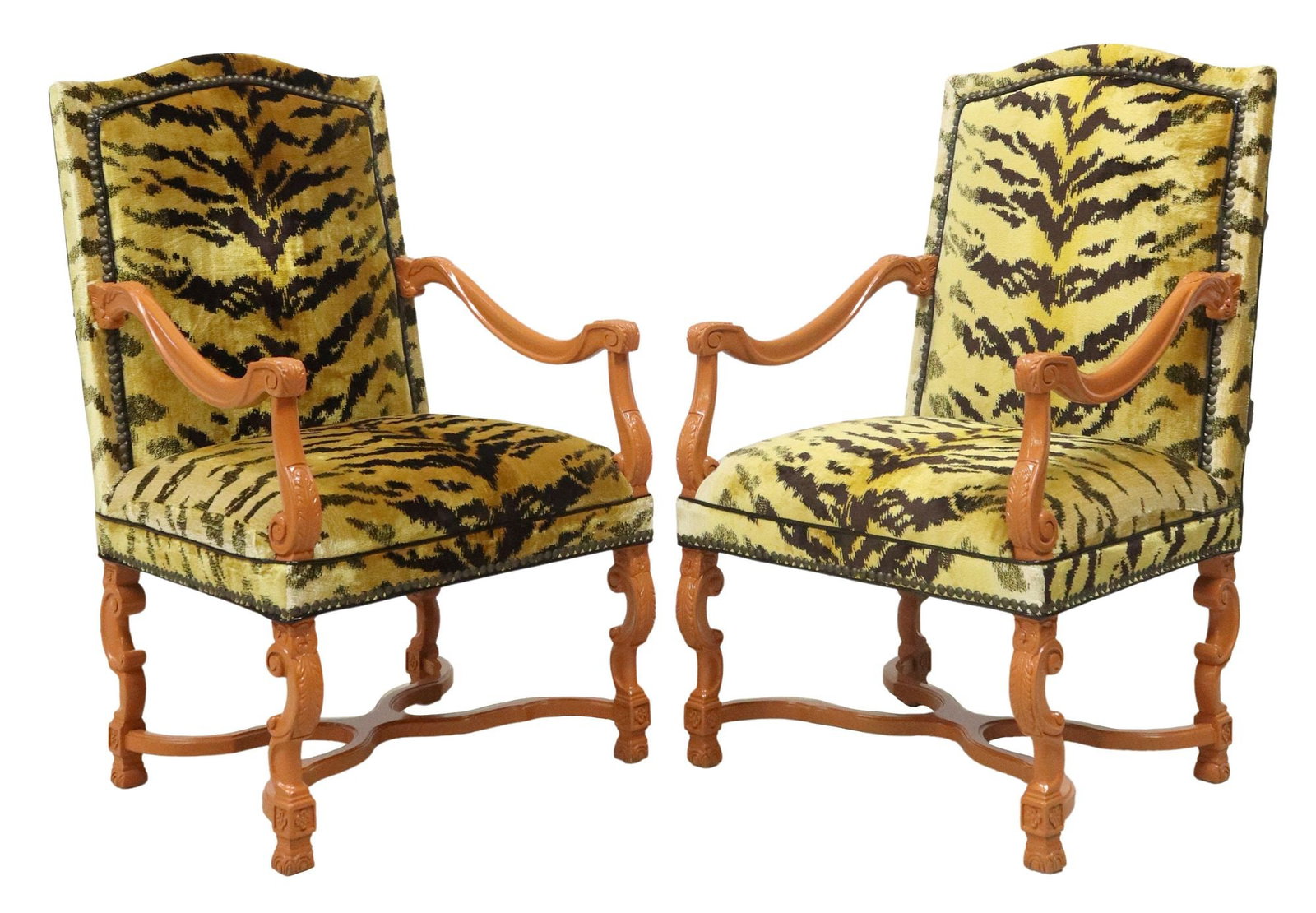 (2) LOUIS XIII STYLE ORANGE ANIMAL PRINT UPHOLSTERED ARMCHAIRS: (pair) Louis XIII style armchairs, late 20th c., each having orange painted wood frame, padded back and seat in tiger print upholstery, with nailhead trim, exterior back in black vinyl upholstery, ris