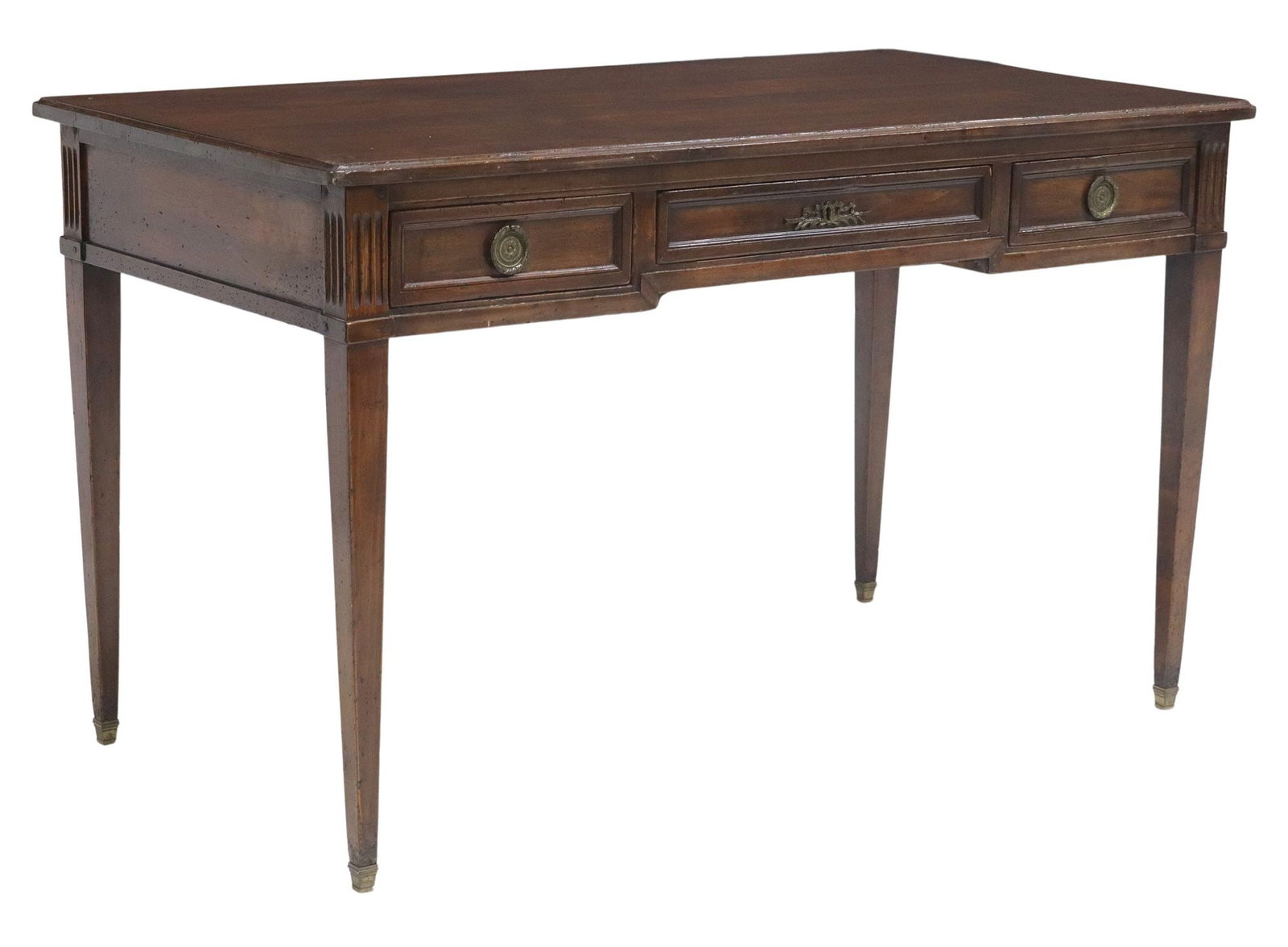 LOUIS XVI STYLE WALNUT BUREAU PLAT/ WRITING DESK: Louis XVI style walnut bureau plat/ writing desk, early 20th c., having rectangular top comprised of six boards, over three drawers with gilt metal garland drawer pulls, flanked by fluted pilaster pos