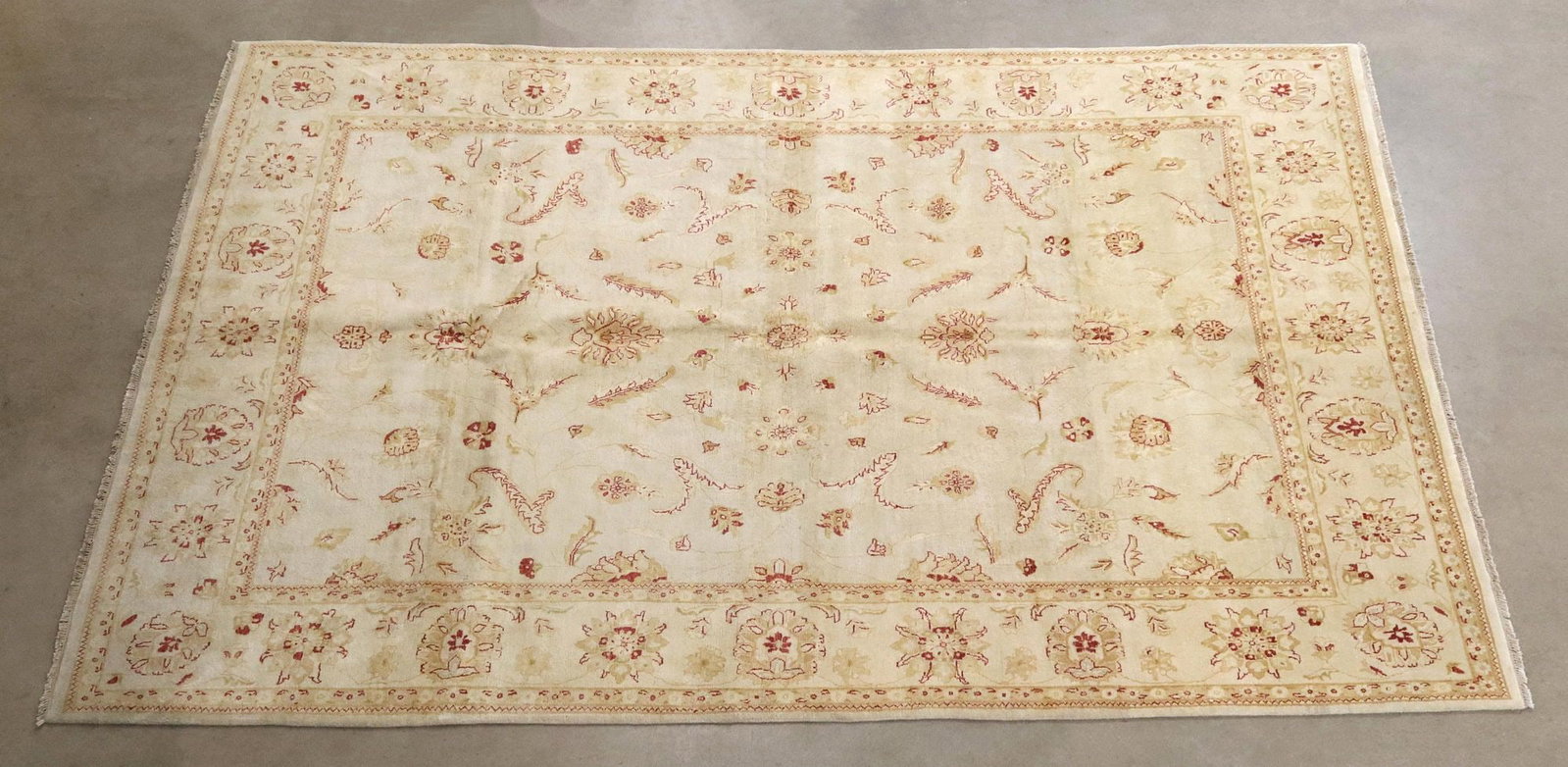 HAND-TIED AGRA WOOL RUG, 12'5.25" X 8'11.25": Hand-tied Agra wool rug, India, some overall tonal variation, approx 12'5.25"l, 8'11.25"w **Please Note: All of the rugs offered in this auction would likely benefit from a professio