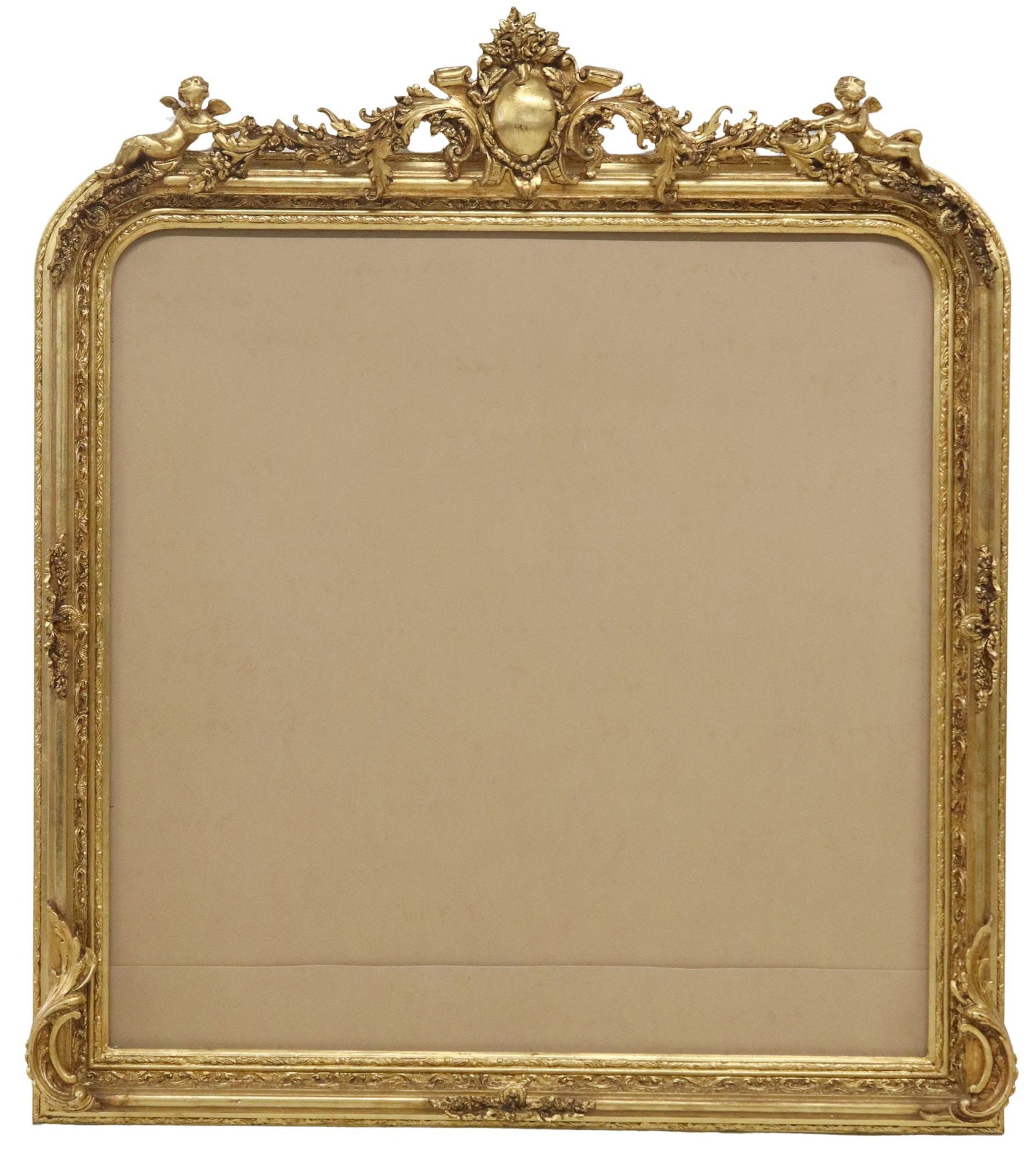 LARGE LOUIS XV STYLE GILT CHERUBS FRAME, 63"H: Large Louis XV style gilt composite frame, 21st c., having shield crest flanked by scrolled foliate swag and winged cherubs, over molded frame, approx 63"h, 52.5"w, 41lbs