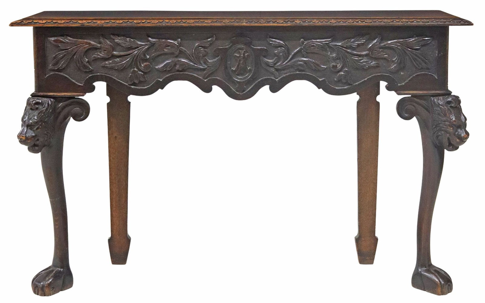ENGLISH VICTORIAN CARVED OAK CONSOLE TABLE: English carved oak console table, late 19th c., narrow rectangular top, carved frieze with central monogram, on front cabriole legs headed by a lion's mask, approx 31.5"h, 51"w, 14"