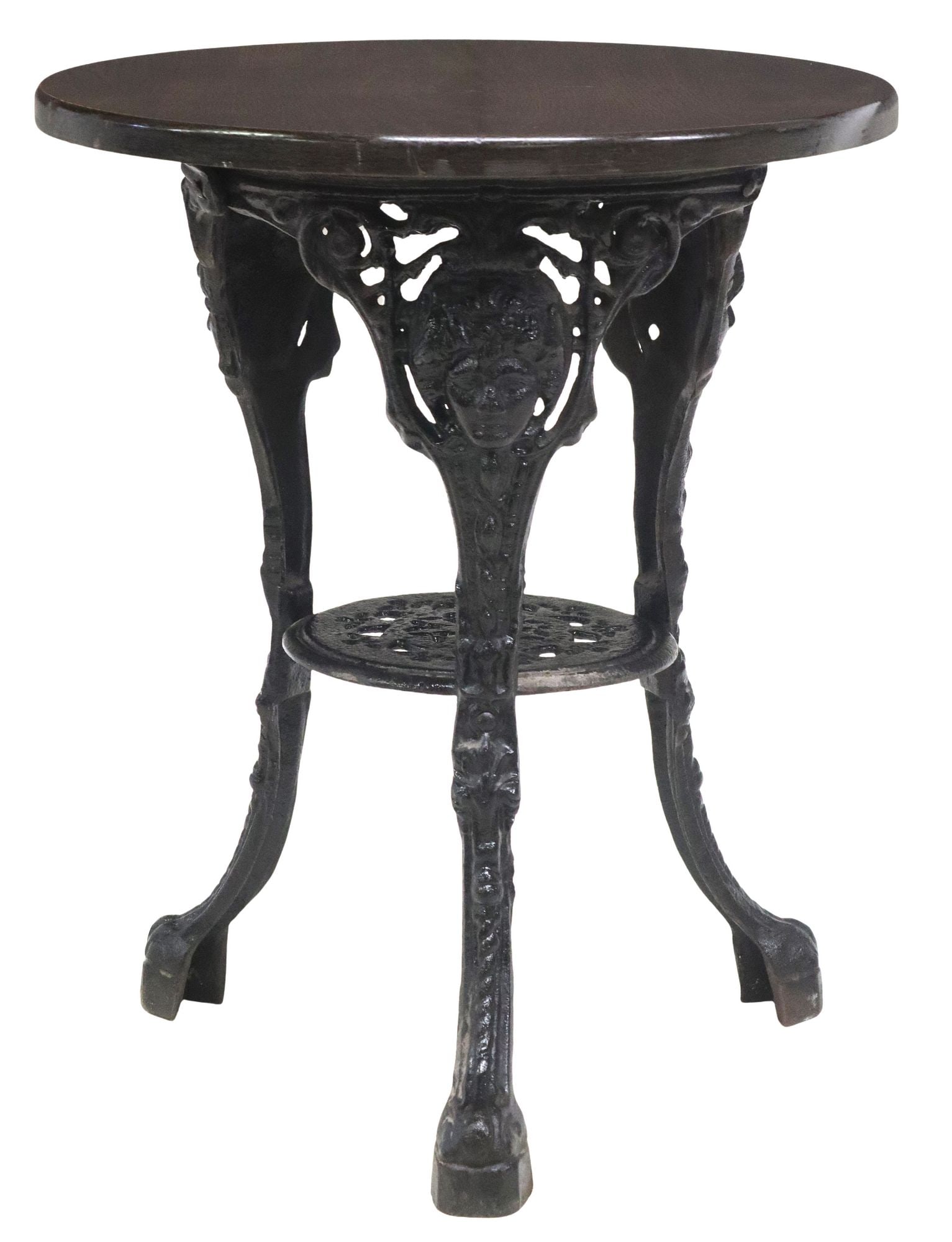 ENGLISH OAK & CAST IRON PUB TABLE: English pub table, 20th c., having round oak tabletop, cast iron base, three legs with classical masks, joined by medial shelf, approx 27.5"h, 23.5"diam
