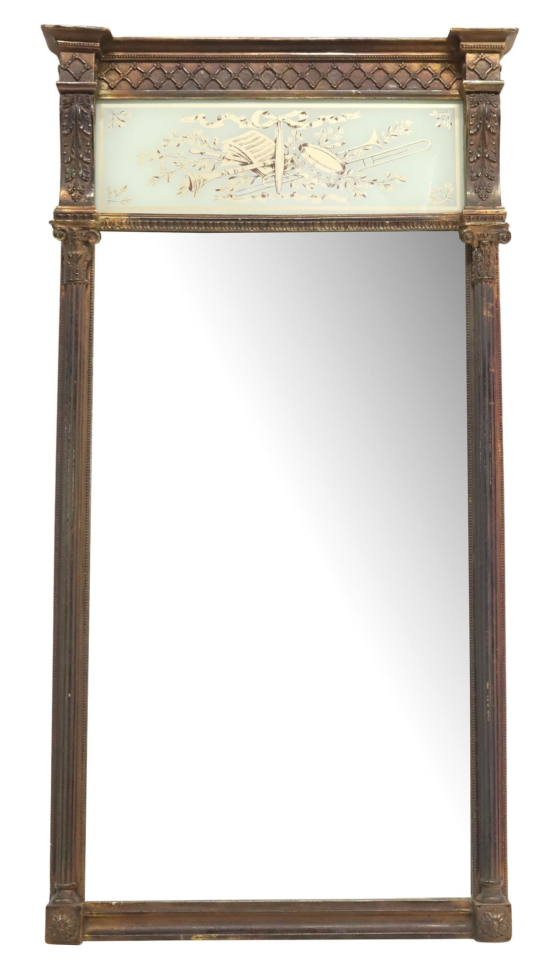 LOUIS XVI STYLE PARCEL GILT INSTRUMENT MOTIF TRUMEAU MIRROR: Louis XVI style parcel gilt trumeau mirror, 20th c., having stepped cornice and molded frieze, above transfer print behind glass, depicting instruments and ribbon motif, dual fluted Corinthian columns