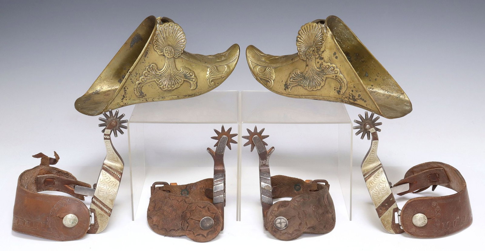 (3 PAIR) COWBOY SPURS & SPANISH COLONIAL STYLE STIRRUPS: (3 pair) Cowboy Spurs, Spanish Colonial Style stirrups: (1) vintage Crockett pair marked on shank, Mullins pattern, silver overlay, 9 point 1.5" rowels, worn and faded leathers stamped Chris Pack