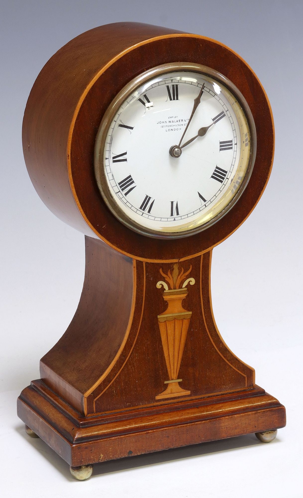 ENGLISH EDWARDIAN PERIOD MARQUETRY CLOCK: English Edwardian period marquetry clock, early 20th c., white enamel dial with Roman numeral hours, marked "Ex'd by John Walker Ltd., 127 Fenchurch St., London," French time only m