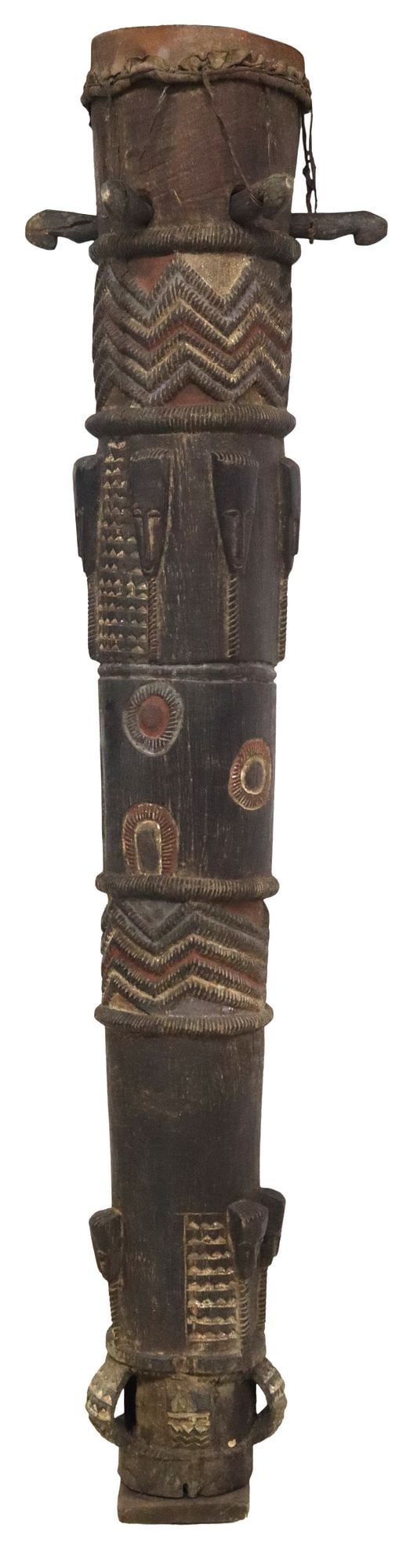 AFRICAN IVORY COAST CARVED WOOD CEREMONIAL ATUNGBLAN DRUM, 71"H: African carved wood Atungblan/ ceremonial drum, likely Baule/ Baoule peoples, Cote d'Ivoire, hide batter head above tapered cylindrical body, with incised geometric motifs and carve