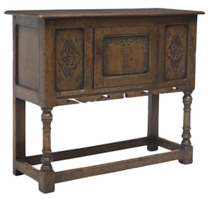 ENGLISH TITCHMARSH & GOODWIN (ATTRIB.) JACOBEAN STYLE OAK CUPBOARD