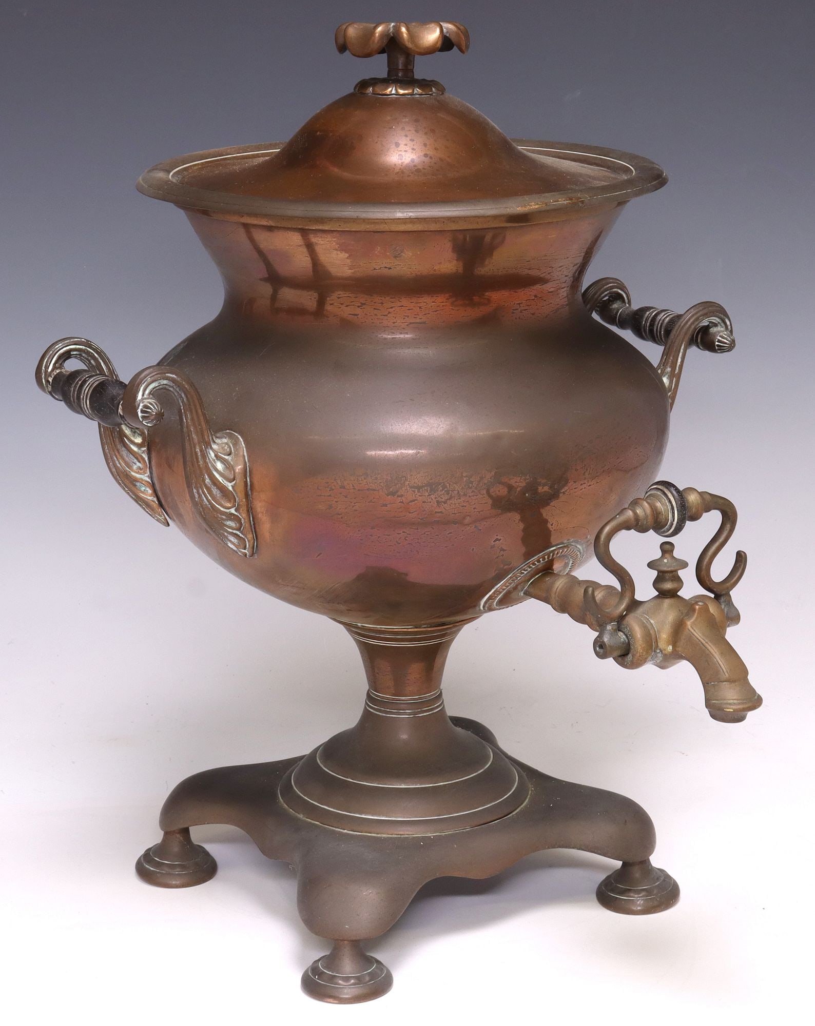 ENGLISH VICTORIAN PATINATED COPPER SAMOVAR / HOT WATER URN: English Victorian patinated copper samovar/ hot water urn, late 19th c., having lid with floral finial, above dual scrolled side handles and turned-form spout, rising on four feet, approx 16.5&qu
