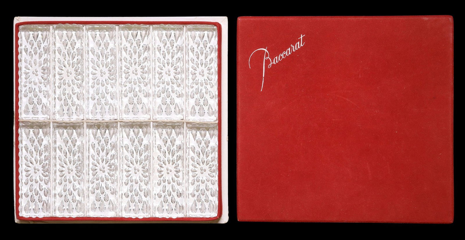 (12) FRENCH BACCARAT 'GOUTTES' CRYSTAL KNIFE RESTS IN BOX: (lot of 12) French Baccarat crystal knife rests, in the "Gouttes d'Eau" pattern, housed in a branded box, each knife rest: approx 0.5"h, 3 3/8"l, 1 1/8"w, box: approx 0.75