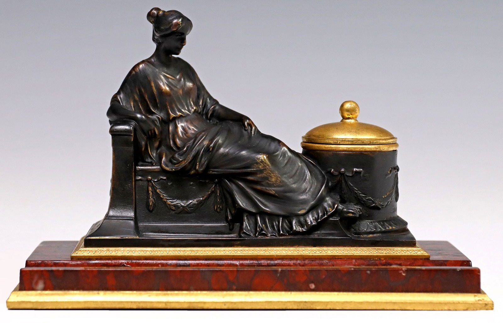 NEOCLASSICAL ORMOLU & PATINATED BRONZE ROUGE MARBLE ENCRIER: Continental gilt and patinated bronze inkstand, late 19th c., bronze signed in cast Burgstaller (George Josef Burgstaller, German, 19th/ early 20th c.), modeled as a reclined maiden with hinged i