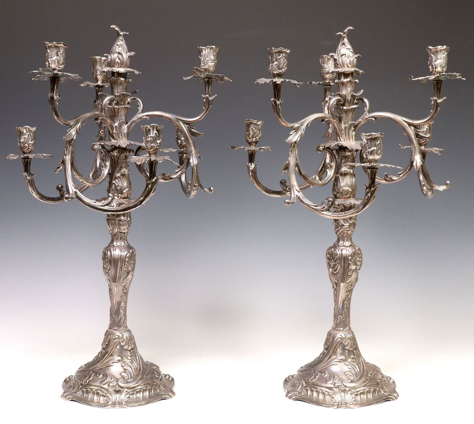 (2) MICHELSEN ROCOCO STYLE STERLING CANDELABRA: (pair) Rococo style sterling silver seven-light candelabra, Anton Michelsen, Copenhagen, Denmark, c.1914, in four sections, convertible into single-light candlesticks, Three Towers hallmark, Christian