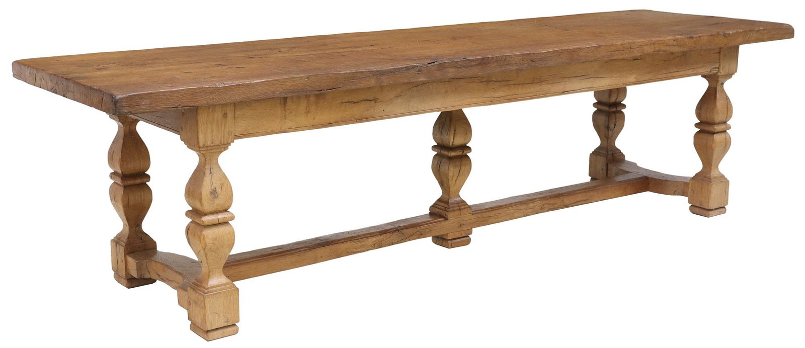 FRENCH PROVINCIAL OAK FARMHOUSE TABLE, 110"L: French Provincial oak farmhouse table, late 19th c./early 20thc, having 2.25" thick plank top on turned supports joined by H-stretcher, terminating on square feet, approx 29.75"h, 110"l, 31"w, clearan