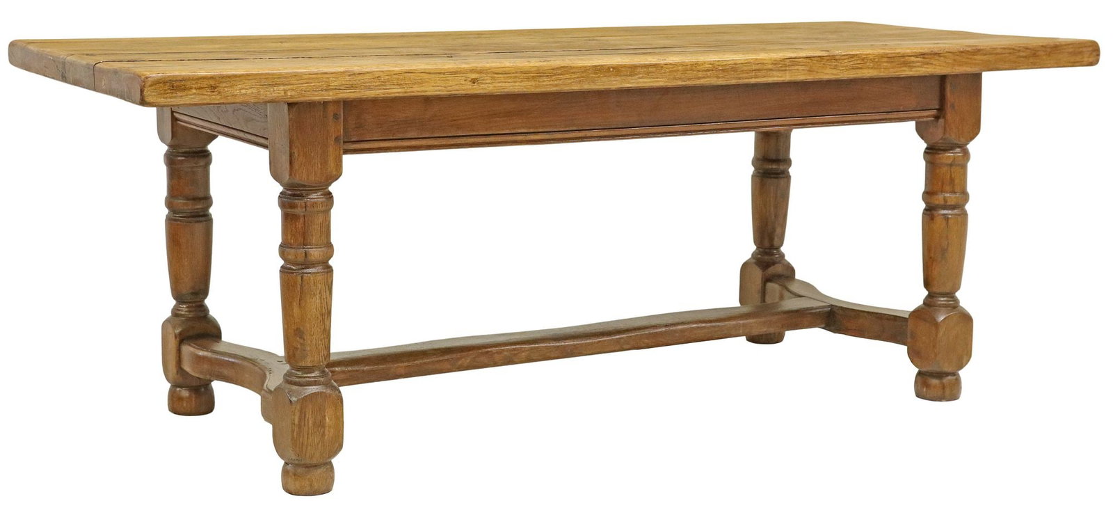 PROVINCIAL OAK FARMHOUSE TABLE: Provincial oak farmhouse table, early 20th c., tabletop comprised of six boards, on turned legs joined by cross stretcher, accompanied by (two) 17.5" pine leaves in a varied finish, approx 29.25&