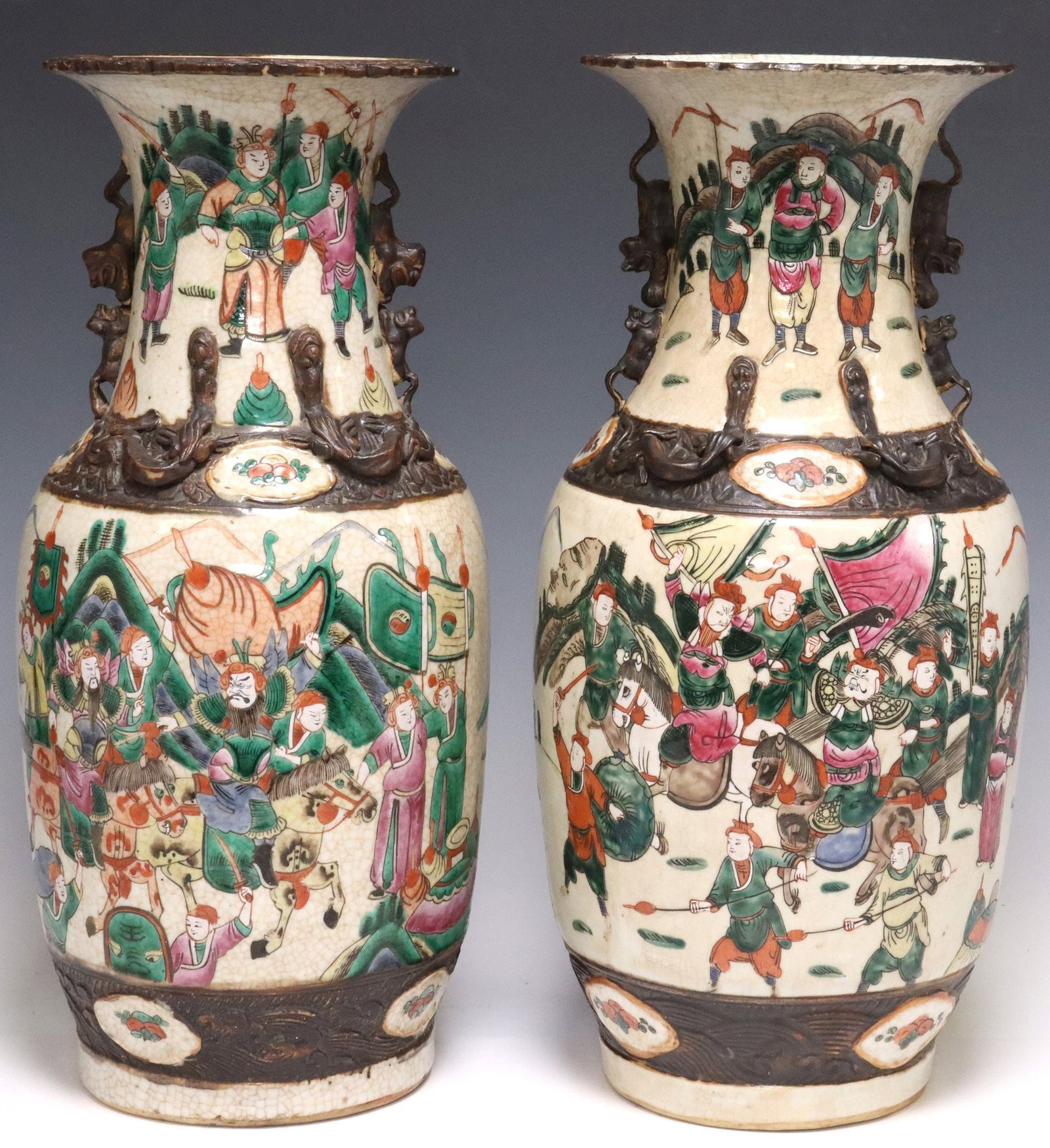 (2) CHINESE FAMILLE ROSE PORCELAIN BALUSTER VASES: (pair) Chinese famille rose porcelain vases, baluster form body with polychrome enameled figural military procession scenes, on crackled ground, sculpted chilongs applied at the neck, four-c
